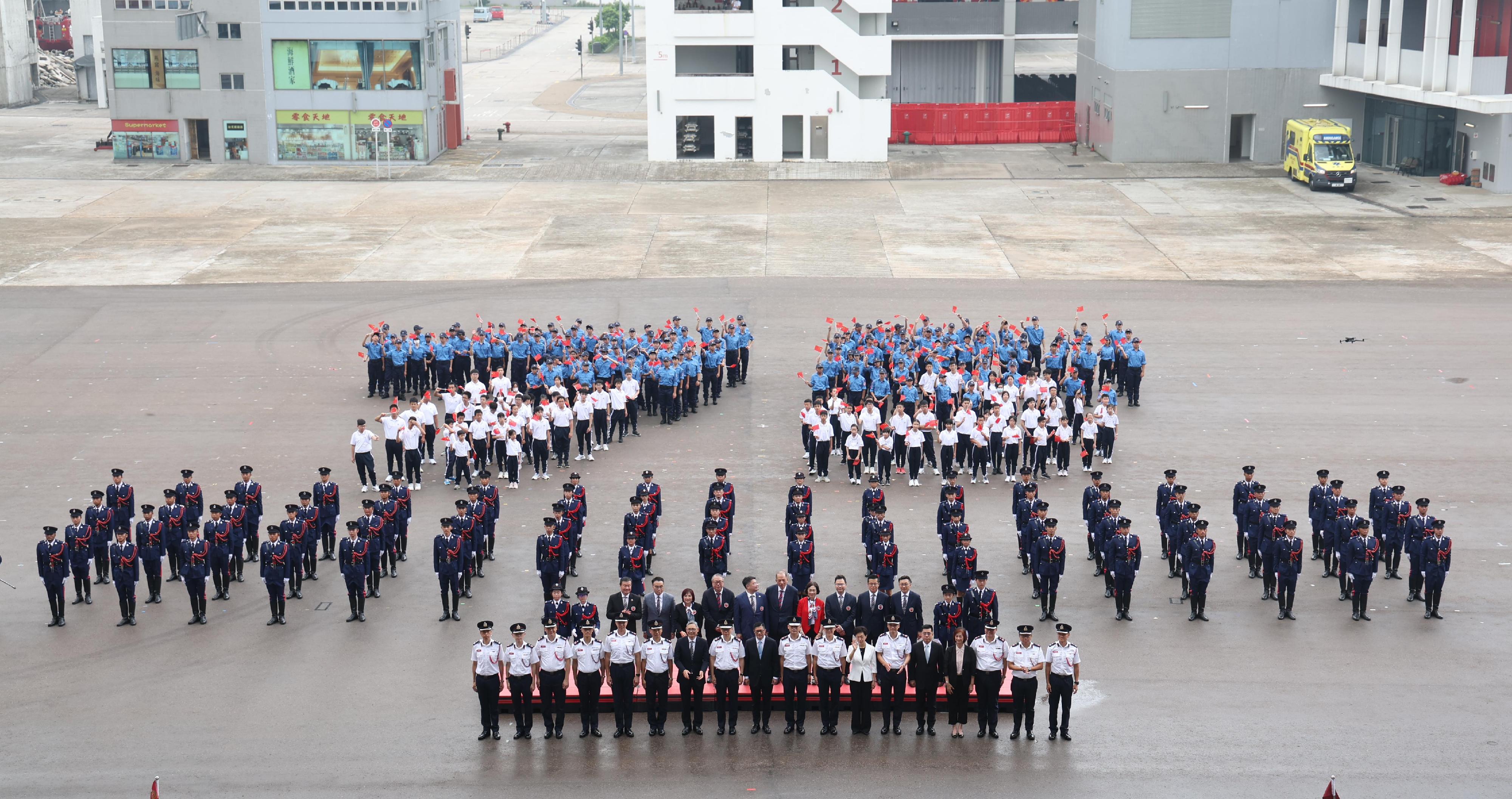 The Secretary for Security, Mr Tang Ping-keung, reviewed the Fire and Ambulance Services Teen Connect Rally in Celebration of the 75th Anniversary of the Founding of the People's Republic of China held by the Fire Services Department today (September 28). Photo shows Mr Tang (first row, ninth left); the Director of Fire Services, Mr Andy Yeung (first row, ninth right); and other guests.