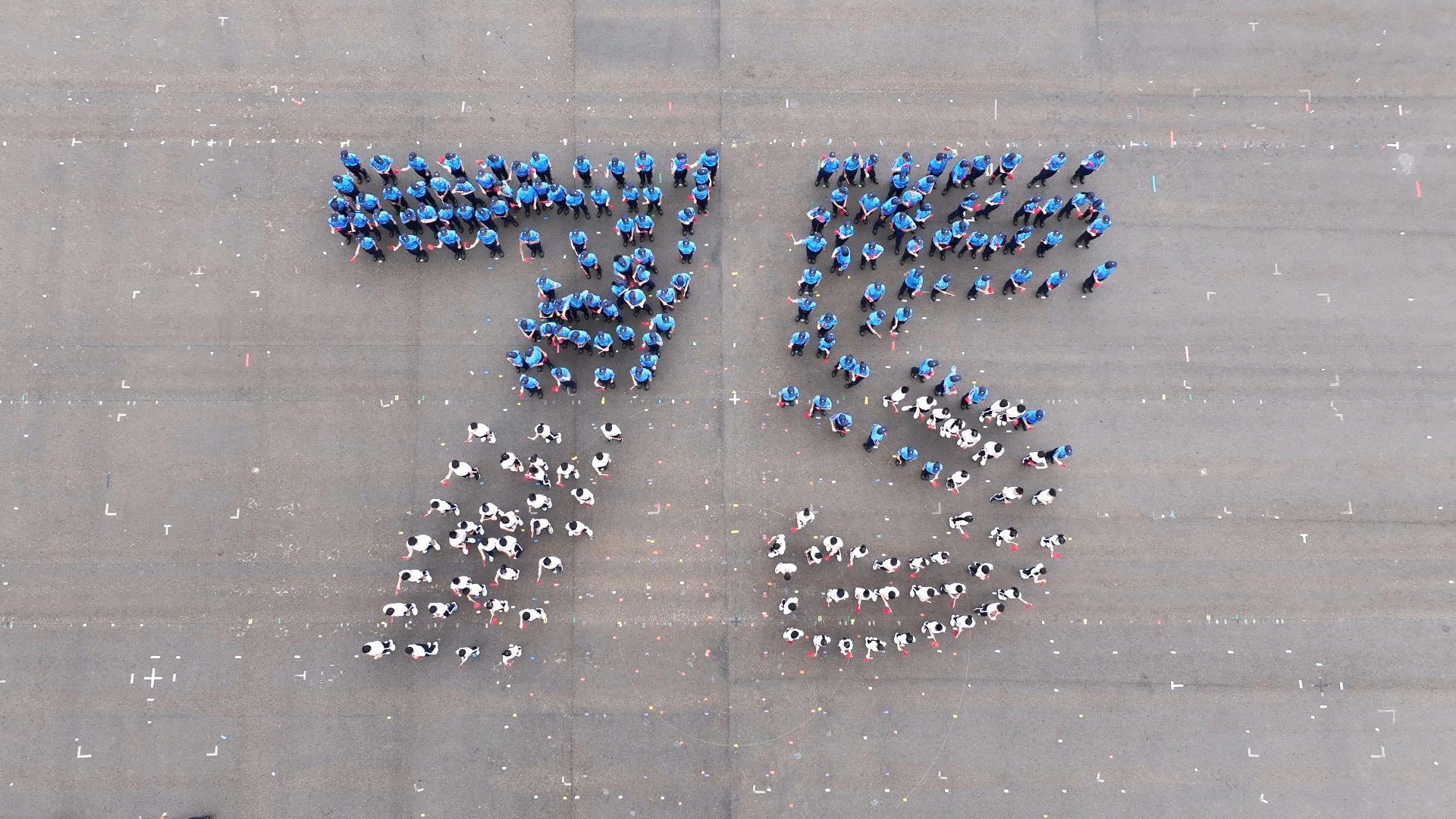 The Secretary for Security, Mr Tang Ping-keung, reviewed the Fire and Ambulance Services Teen Connect (FAST Connect) Rally in Celebration of the 75th Anniversary of the Founding of the People's Republic of China held by the Fire Services Department today (September 28). Photo shows FAST Connect members formulating numerals “75”, in celebration of the 75th anniversary of the founding of the People's Republic of China.