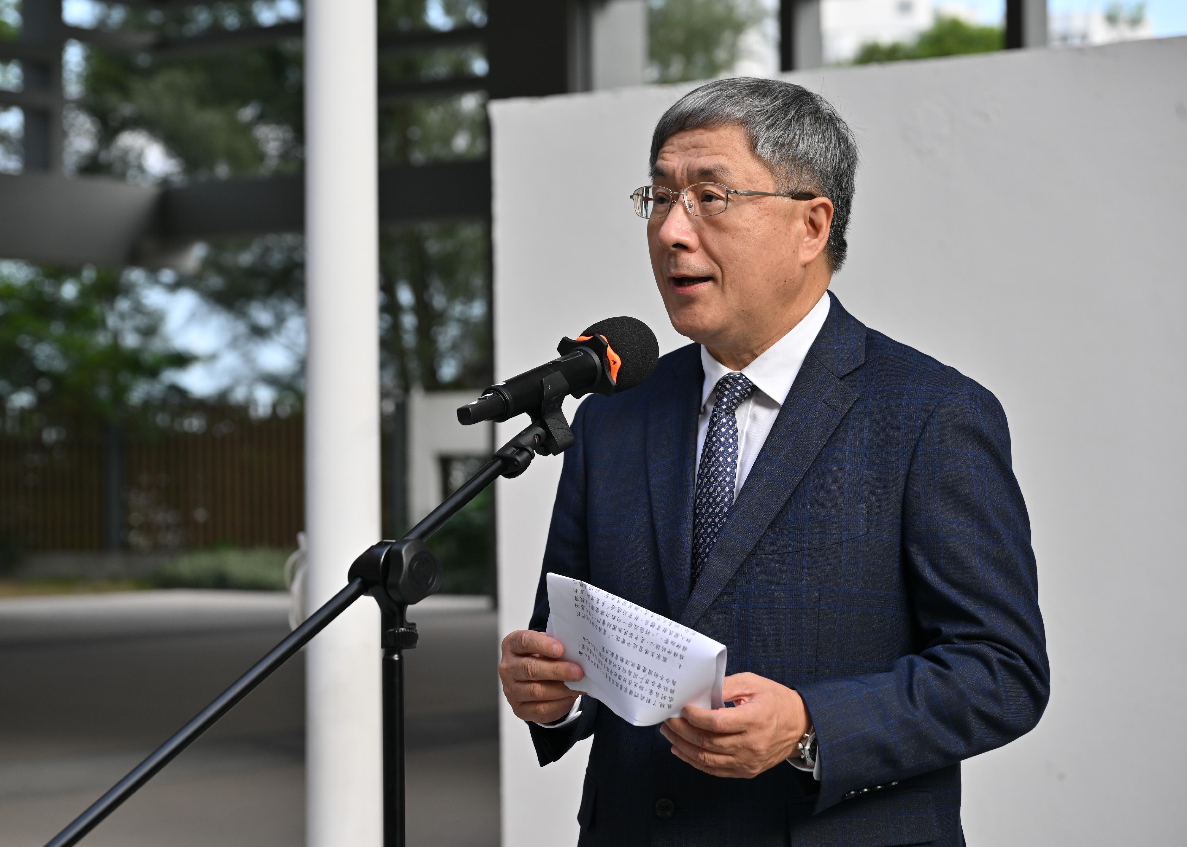 The Deputy Chief Secretary for Administration, Mr Cheuk Wing-hing, speaks at the national flag-raising ceremony of TWGHs Tsoi Wing Sing Primary School today (September 30).