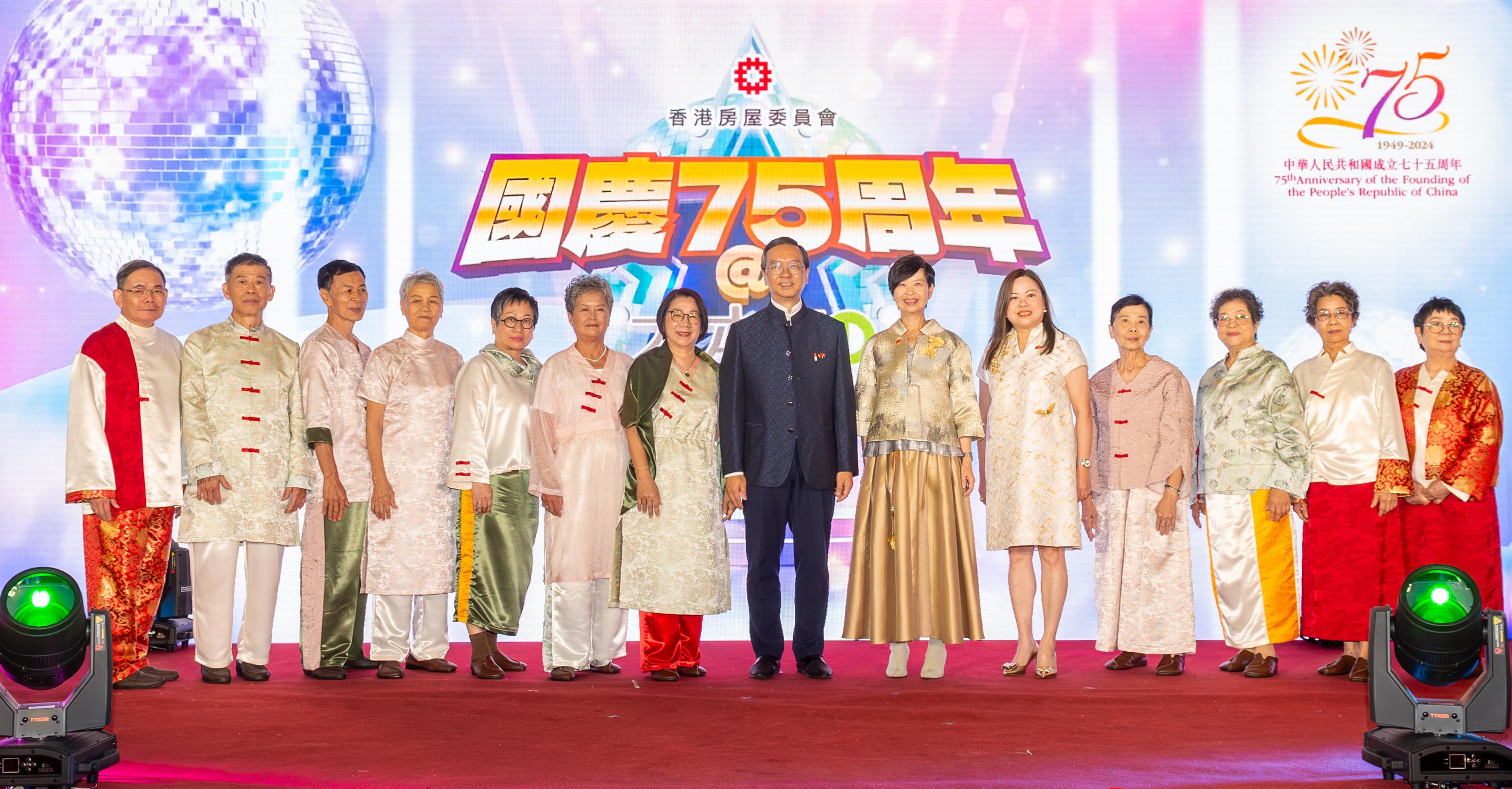 The Hong Kong Housing Authority (HA) today (October 1) held the National Day 75th Anniversary@Domain event at Domain shopping mall in Yau Tong. Photo shows the Secretary for Housing and Chairman of the HA, Ms Winnie Ho (sixth right) in a fashion show, leading 11 elderly people from different public housing estates wearing costumes, rich in Chinese elements, designed by the School of Fashion and Textiles of the Hong Kong Polytechnic University.  The Permanent Secretary for Housing and Director of Housing, Miss Rosanna Law (fifth right), and the Under Secretary for Housing, Mr Victor Tai (seventh right), joined the catwalk wearing traditional Chinese costumes.