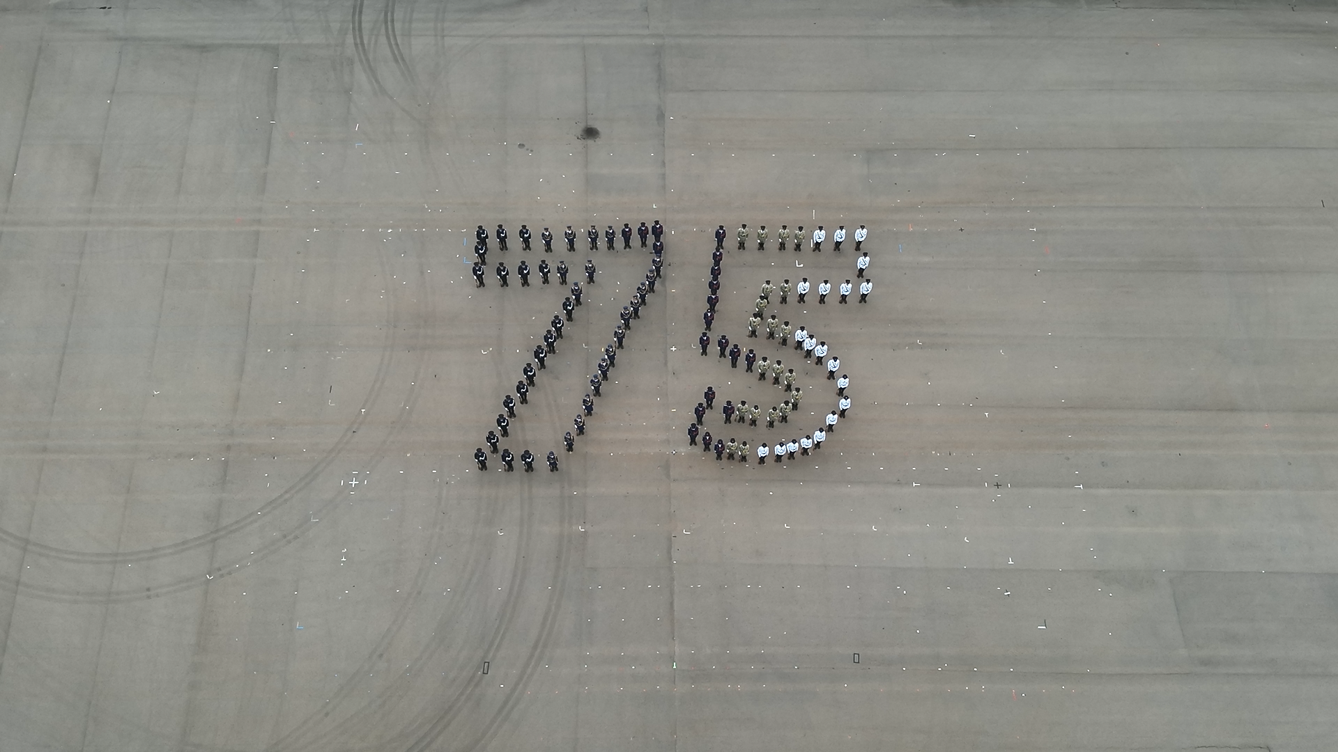 The Security Bureau led its disciplined services and auxiliary services, together with youth uniformed groups, to hold the Grand Parade by Disciplined Services and Youth Groups cum Fun Day for Celebrating the 75th Anniversary of the Founding of the People's Republic of China at the Fire and Ambulance Services Academy in Tseung Kwan O today (October 1). Photo shows members of the disciplined services forming the pattern representing the number "75" during the joint foot drill demonstration.