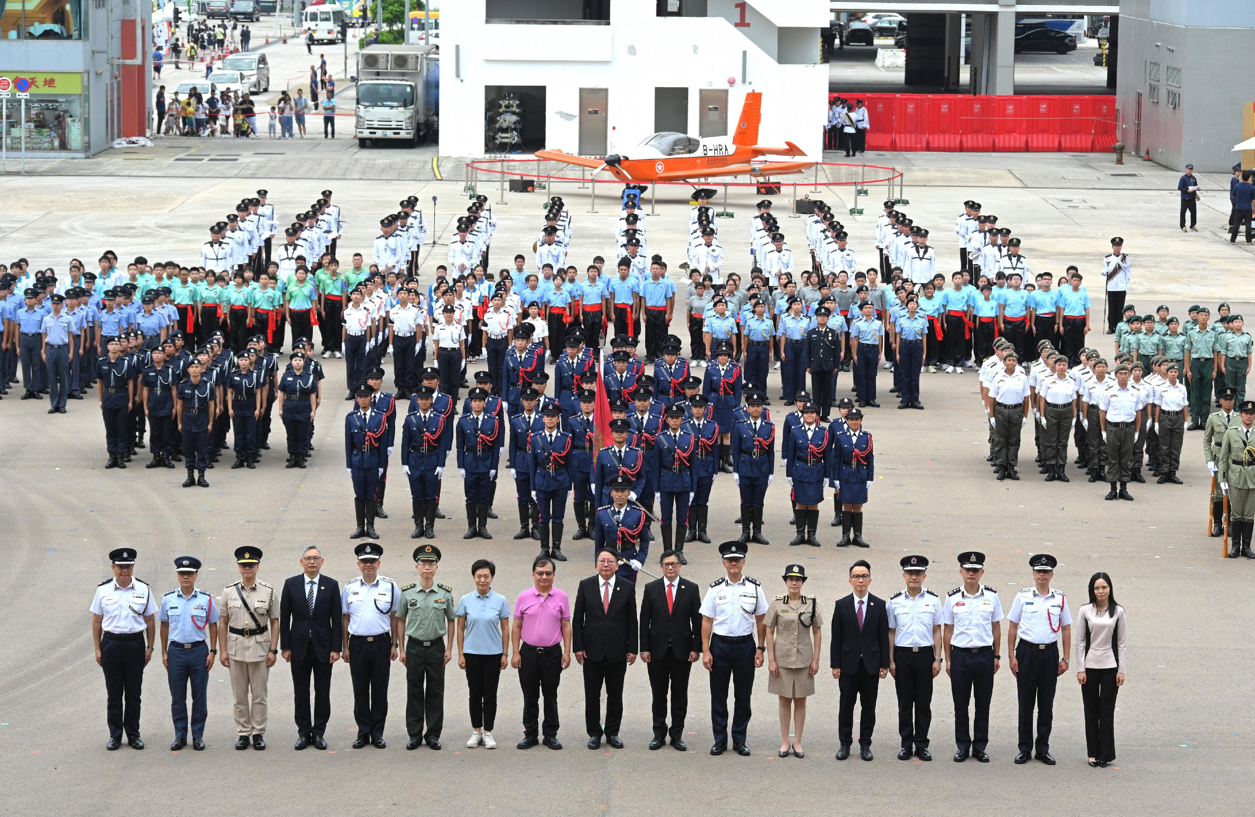 The Security Bureau led its disciplined services and auxiliary services, together with youth uniformed groups, to hold the Grand Parade by Disciplined Services and Youth Groups cum Fun Day for Celebrating the 75th Anniversary of the Founding of the People's Republic of China at the Fire and Ambulance Services Academy in Tseung Kwan O today (October 1). Photo shows (front row from left) the Commandant of Hong Kong Auxiliary Police Force, Mr Yang Joe-tsi; the Controller of Government Flying Service, Captain West Wu; the Commissioner of Correctional Services, Mr Wong Kwok-hing; the Under Secretary for Security, Mr Michael Cheuk; the Director of Immigration, Mr Benson Kwok; the People's Liberation Army Hong Kong Garrison Colonel Gao Feng; the Deputy Director of the Police Liaison Department of the Liaison Office of the Central People's Government, Ms Meng Xiaoyuan; the Deputy Commissioner of the Office of the Commissioner of the Ministry of Foreign Affairs of the People's Republic of China in the Hong Kong Special Administrative Region, Mr Fang Jianming; officiating guest, the Chief Secretary for Administration, Mr Chan Kwok-ki; the Secretary for Security, Mr Tang Ping-keung; the Commissioner of Police, Mr Siu Chak-yee; the Commissioner of Customs and Excise, Ms Louise Ho; the Permanent Secretary for Security, Mr Patrick Li; the Commissioner of Auxiliary Medical Service, Dr Ronald Lam; the Director of Fire Services, Mr Andy Yeung; the Commissioner of Civil Aid Service, Mr Lo Yan-Lai; the Acting Director of Broadcasting, Ms Christine Wai, and performers at the event.