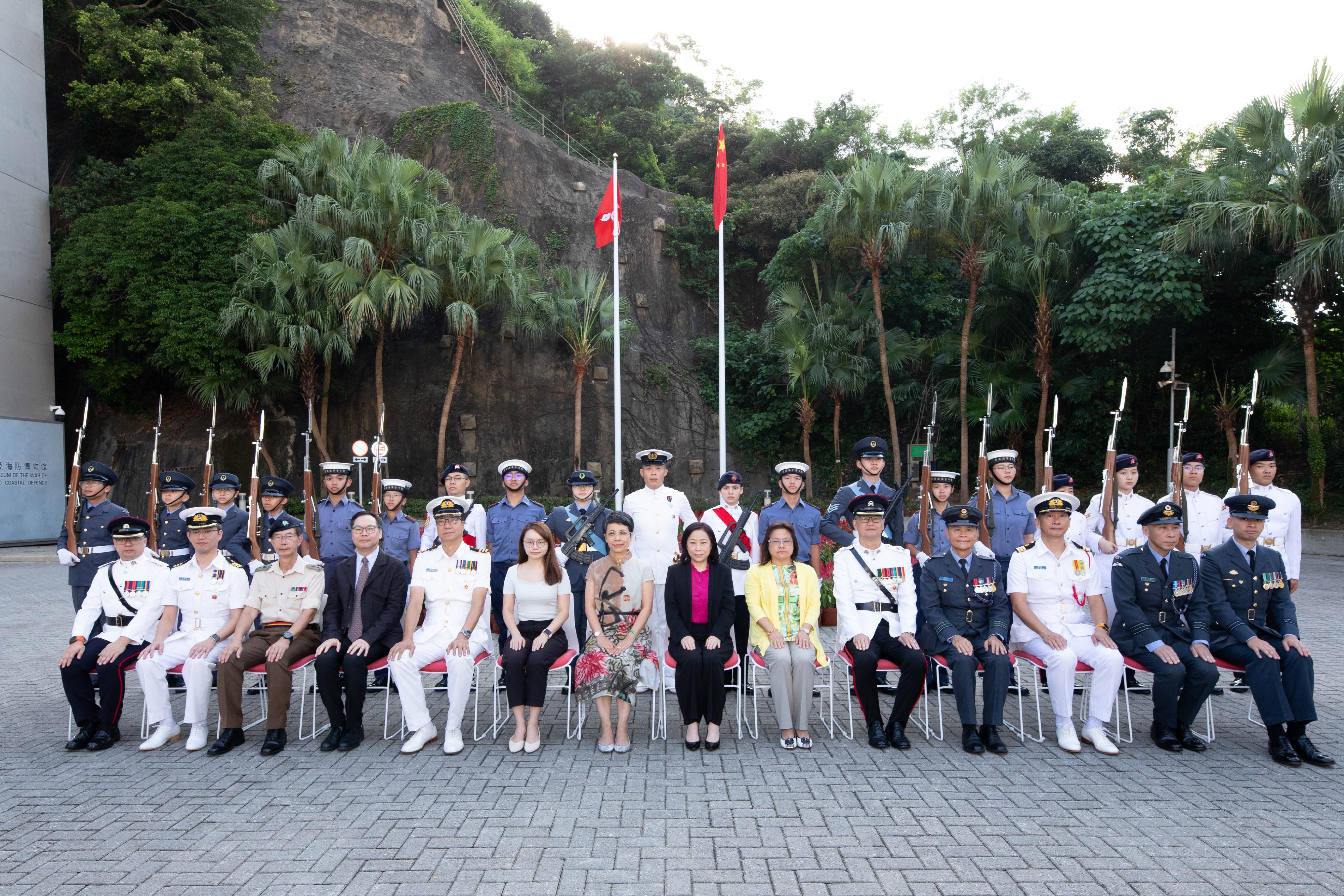 In celebration of the 75th anniversary of the founding of the People's Republic of China, the Leisure and Cultural Services Department today (October 1) presented the National Day Flag Raising Ceremony cum Drill Performance at the Hong Kong Museum of the War of Resistance and Coastal Defence with the Hong Kong Adventure Corps, the Hong Kong Sea Cadet Corps and the Hong Kong Air Cadet Corps. Photo shows the Museum Director of Hong Kong Museum of History, Mr Terence Cheung (front row, fourth left); Deputy Commanding Officer of the Hong Kong Sea Cadet Corps, Commander Ricky Fung (front row, fifth left); the Assistant District Officer of the Eastern District, Ms Jasmine Chiu (front row, sixth left); the Deputy Director of Leisure and Cultural Services (Culture), Miss Eve Tam (front row, seventh left); the Deputy Secretary for Culture, Sports and Tourism, Ms Winnie Tse (front row, eighth left); the Principal Assistant Secretary (Education Commission and Planning) of the Education Bureau, Ms Cynthia Chan (front row, ninth left); Deputy Commandant (Operations and Training) of the Hong Kong Adventure Corps, Lieutenant Colonel Ricky Kwong (front row, tenth left); and Deputy Commanding Officer (Training) of the Hong Kong Air Cadet Corps, Wing Commander Roger Kwong (front row, eleventh left) officiating at the event.