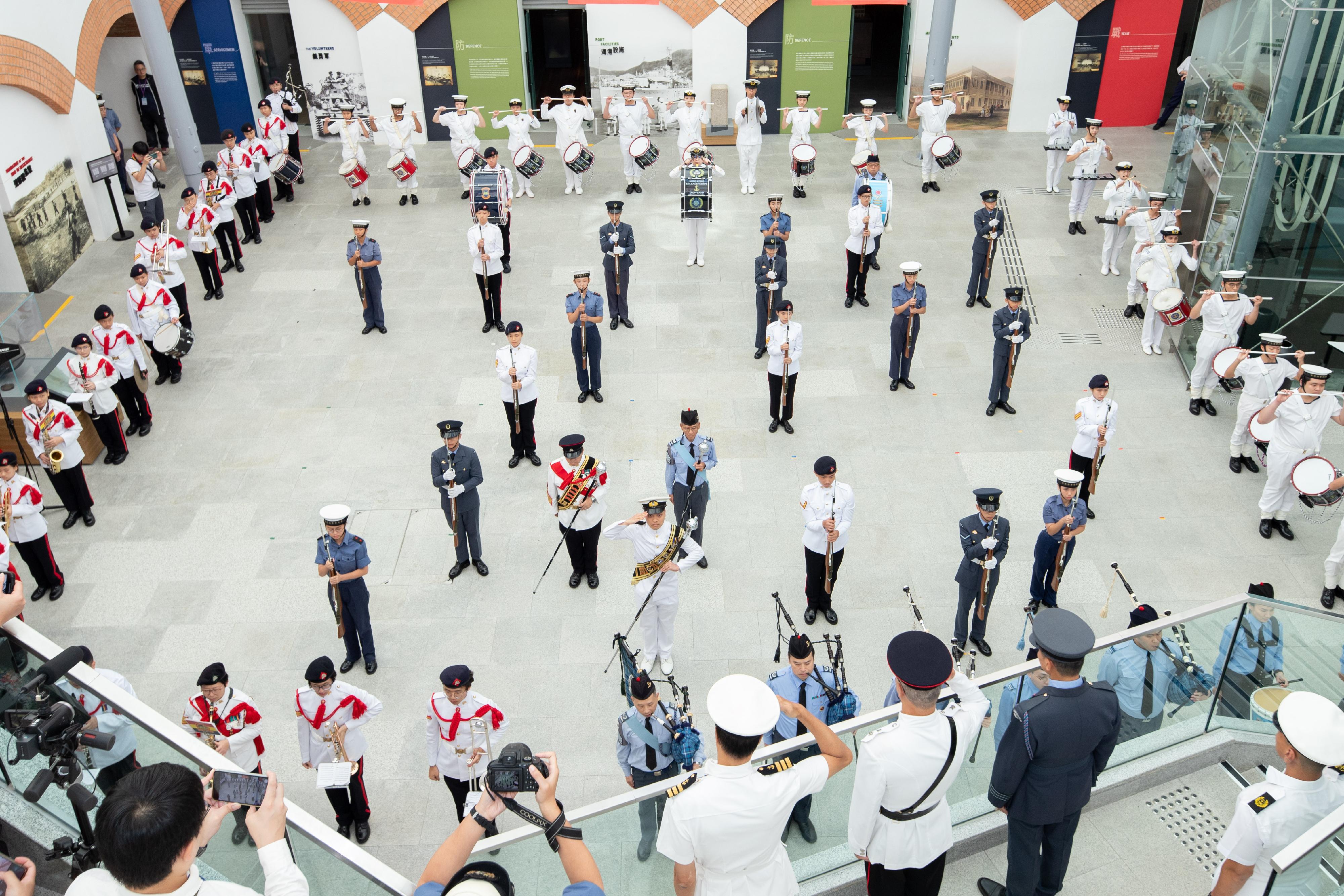 In celebration of the 75th anniversary of the founding of the People's Republic of China, the Leisure and Cultural Services Department today (October 1) presented the "National Day Flag Raising Ceremony cum Drill Performance" at the Hong Kong Museum of the War of Resistance and Coastal Defence with the Hong Kong Adventure Corps, the Hong Kong Sea Cadet Corps and the Hong Kong Air Cadet Corps. Photo shows a pattern of the number "75" specially formed by the young cadets of the uniformed groups in the drill performances to celebrate the 75th anniversary of the founding of the People's Republic of China. 