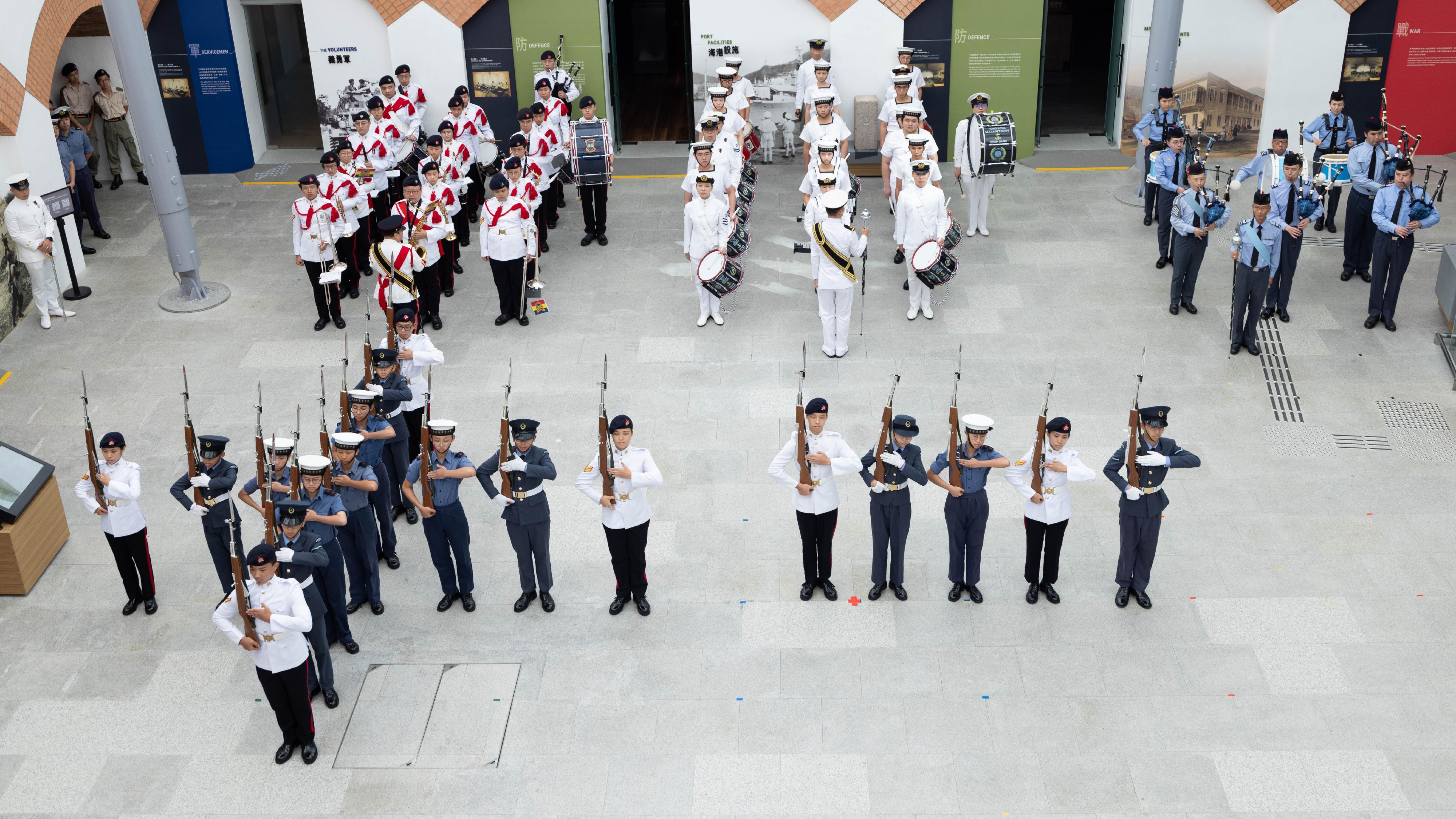 In celebration of the 75th anniversary of the founding of the People's Republic of China, the Leisure and Cultural Services Department today (October 1) presented the "National Day Flag Raising Ceremony cum Drill Performance" at the Hong Kong Museum of the War of Resistance and Coastal Defence with the Hong Kong Adventure Corps, the Hong Kong Sea Cadet Corps and the Hong Kong Air Cadet Corps. Photo shows a pattern of the Chinese numerals "10" and "1" specially formed by the young cadets of the uniformed groups in the drill performances. 
