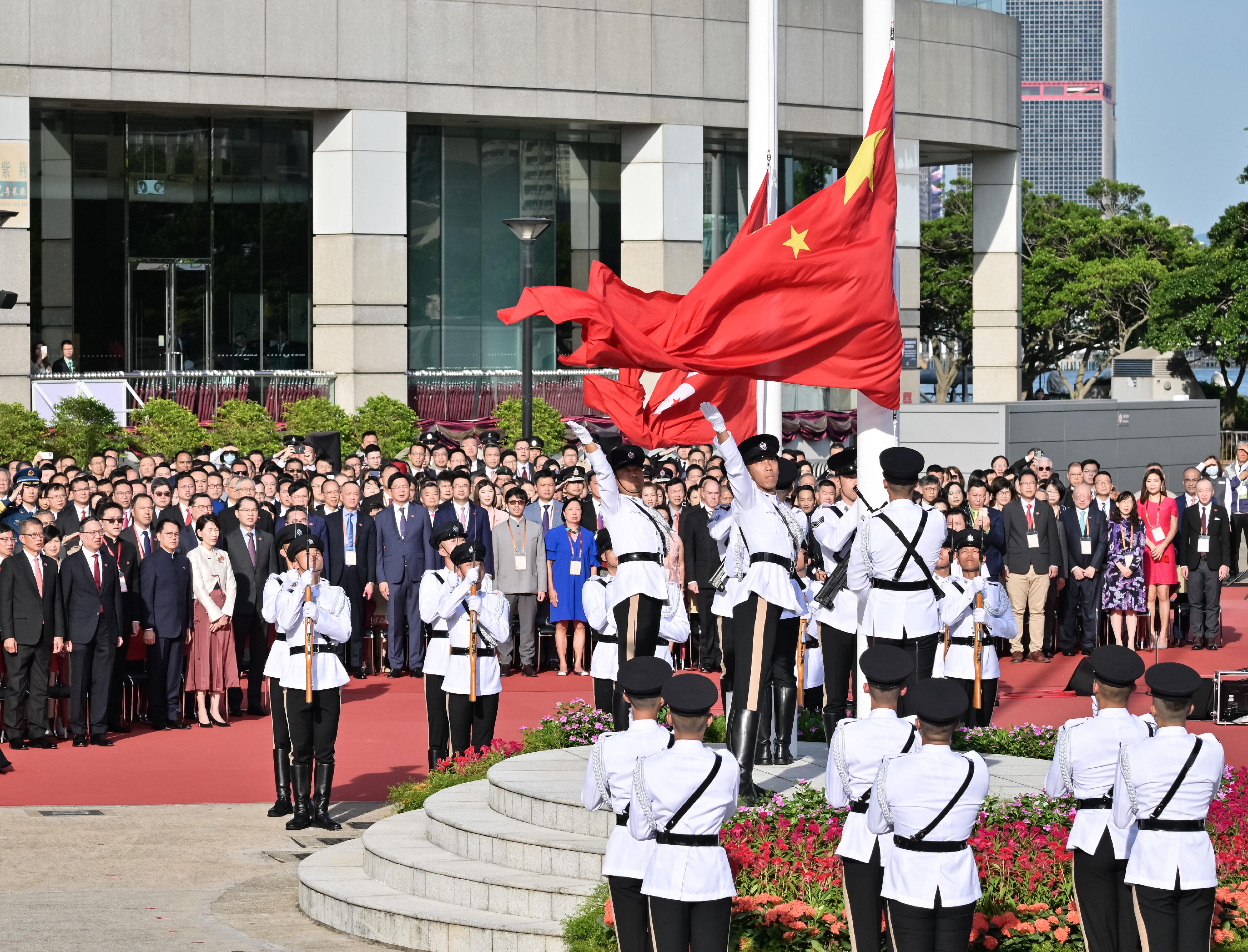 The Chief Executive, Mr John Lee, together with Principal Officials and guests, attends the flag-raising ceremony for the 75th anniversary of the founding of the People's Republic of China at Golden Bauhinia Square in Wan Chai this morning (October 1).