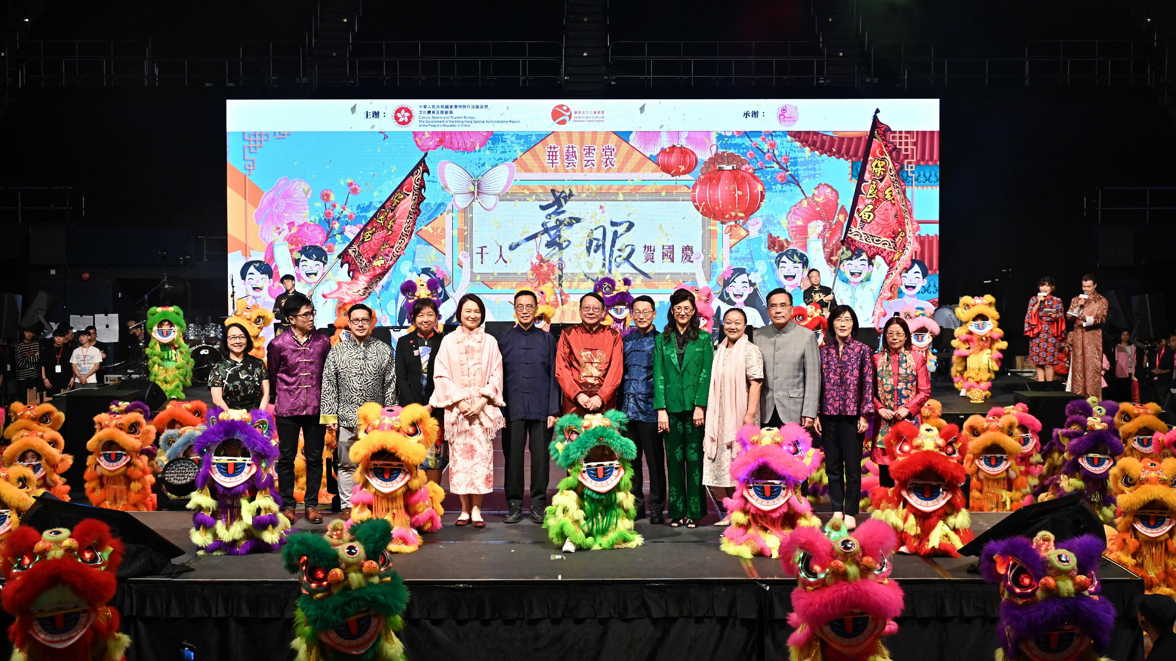 The Chief Secretary for Administration, Mr Chan Kwok-ki, attended the "Celebration of National Day - A Thousand Youths in Chinese Costumes" evening gala today (October 4). Photo shows (from fifth left) the Convenor of the Working Group on Patriotic Education under the Constitution and Basic Law Promotion Steering Committee, Ms Starry Lee; the Secretary for Culture, Sports and Tourism, Mr Kevin Yeung; Mr Chan; the Director of Leisure and Cultural Services, Mr Vincent Liu; and the Chairman of the Paso a Paso Foundation Limited, Ms Melissa Pang, and other guests at the event.