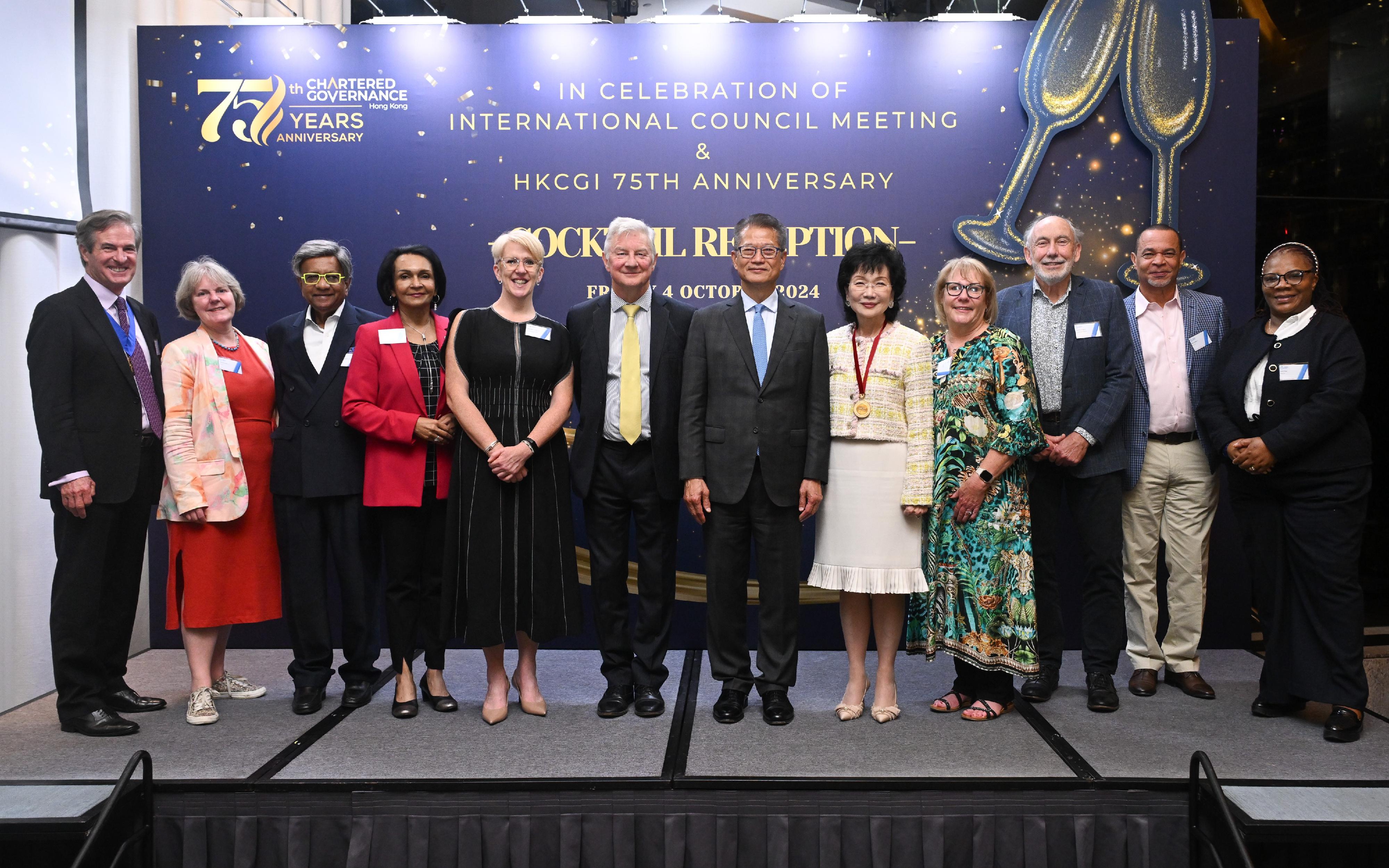 The Financial Secretary, Mr Paul Chan, attended the Hong Kong Chartered Governance Institute (HKCGI) Cocktail Reception in Celebration of International Council Meeting and the HKCGI's 75th Anniversary today (October 4). Photo shows Mr Chan (sixth right); the President of Chartered Governance Institute (CGI), Mr John Heaton (sixth left); the Past International President of CGI, Ms Edith Shih (fifth right); the President of the HKCGI, Mr David Simmonds (first left), and other guests at the reception.