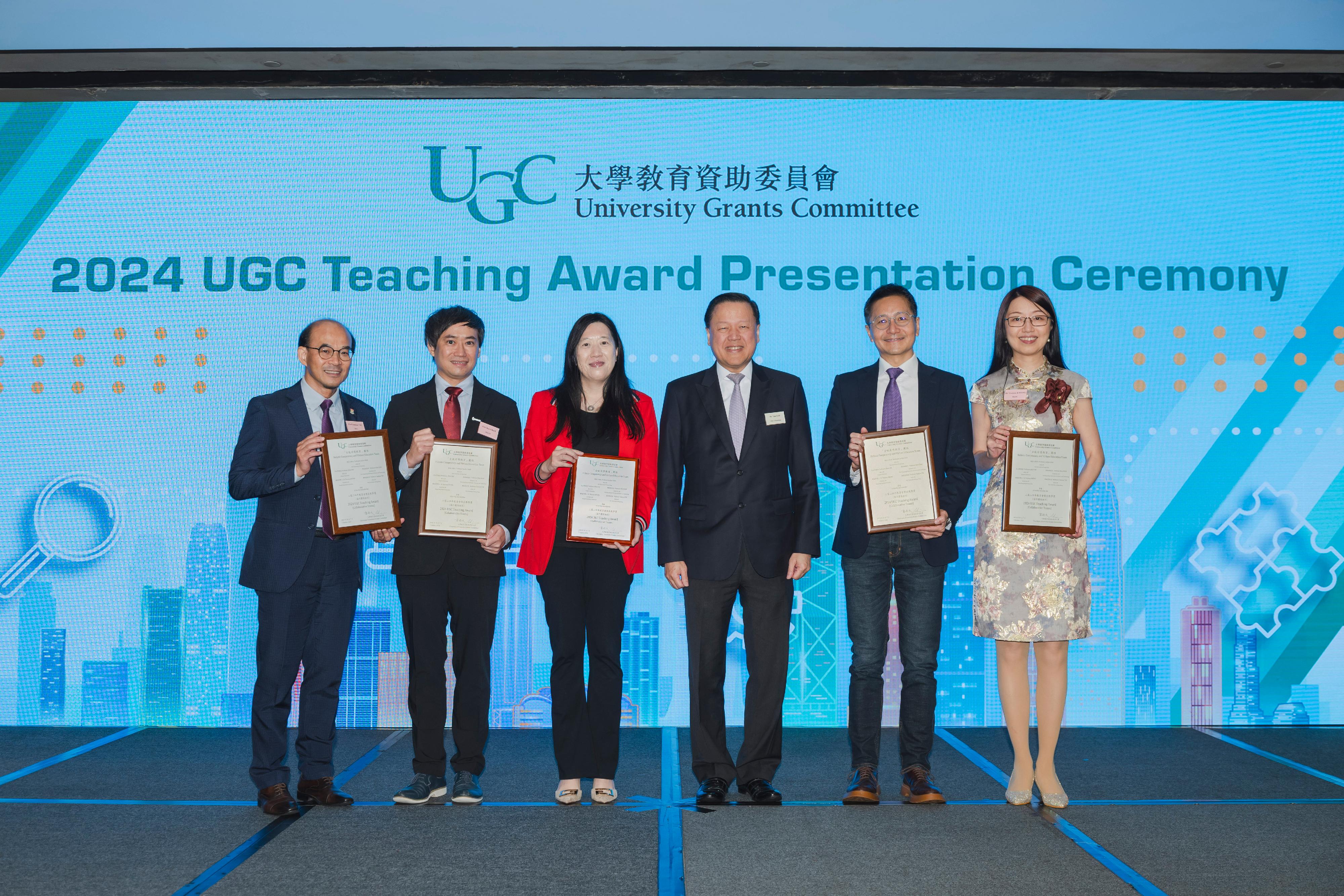 The Chairman of the University Grants Committee (UGC), Mr Tim Lui (third right), today (October 7) presents the 2024 UGC Teaching Award for Collaborative Teams to the Holistic Competency and Virtues Education Team.  The team is led by Professor Cecilia Chan Ka-yuk (third left), with Professor Albert Ko Wing-yin (second right), Professor Ben Chan Yui-bun (second left), Dr Theresa Kwong Fuk-ning (first right) and Professor Samson Tse Shu-ki (first left) as collaborative team members.
