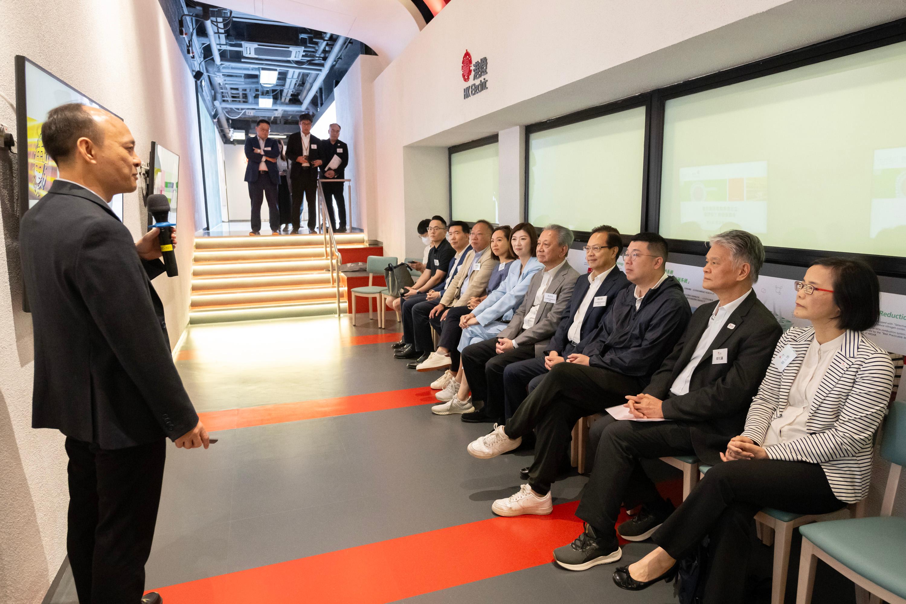 The Legislative Council Panel on Environmental Affairs visits Lamma Power Station of the Hongkong Electric Company, Limited (HEC) today (October 7). Photo shows Members receiving a briefing on the operation of Lamma Power Station from representatives of the HEC.