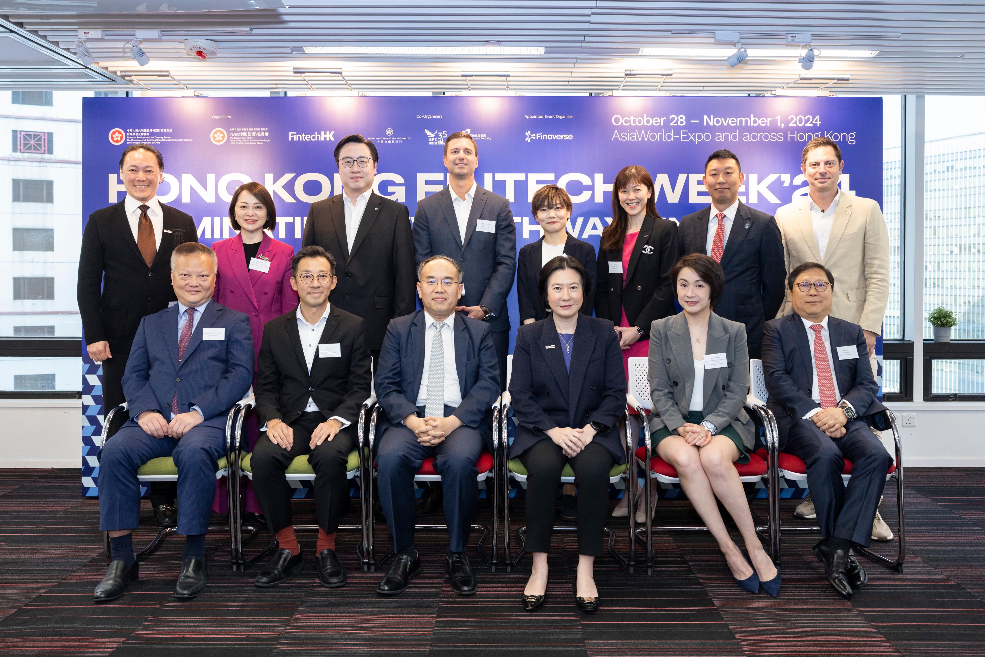 Invest Hong Kong (InvestHK) today (October 8) announced details of Hong Kong FinTech Week 2024. Photo shows (front row, from left) the Associate Director, Policy and Legislation of the Insurance Authority, Mr Tony Chan; the Chief Fintech Officer of the Hong Kong Monetary Authority, Mr George Chou; the Secretary for Financial Services and the Treasury, Mr Christopher Hui; the Director-General of Investment Promotion of InvestHK, Ms Alpha Lau; the Director of Licensing and Head of Fintech unit, Intermediaries of the Securities and Futures Commission, Ms Elizabeth Wong; and the Group Chief Information Officer of Hong Kong Exchanges and Clearing Limited, Mr Richard Leung. Also present are (back row, from left) the Global Head of Financial Services, Fintech & Sustainability of InvestHK, Mr King Leung; the Executive Vice President, Strategy Development and Government Affairs, Greater Bay Area of Ant Group, Ms Jennifer Tan; the General Manager, Personal Digital Banking Product Department, Bank of China (Hong Kong) Mr Arnold Chow; the Chief Digital Officer of HSBC Hong Kong, Mr Bojan Obradović; the Head, Digital Banking, Client Experience and Analytics of Standard Chartered Hong Kong, Ms Esther Mai; the Head of Digital Growth of Citi Hong Kong, Ms Sarah O; the Vice President, Asia Pacific of Circle, Mr Chan Yam-ki; and the Co-Founder and Chief Executive Officer of Finoverse, Mr Anthony Sar, at today's announcement event.