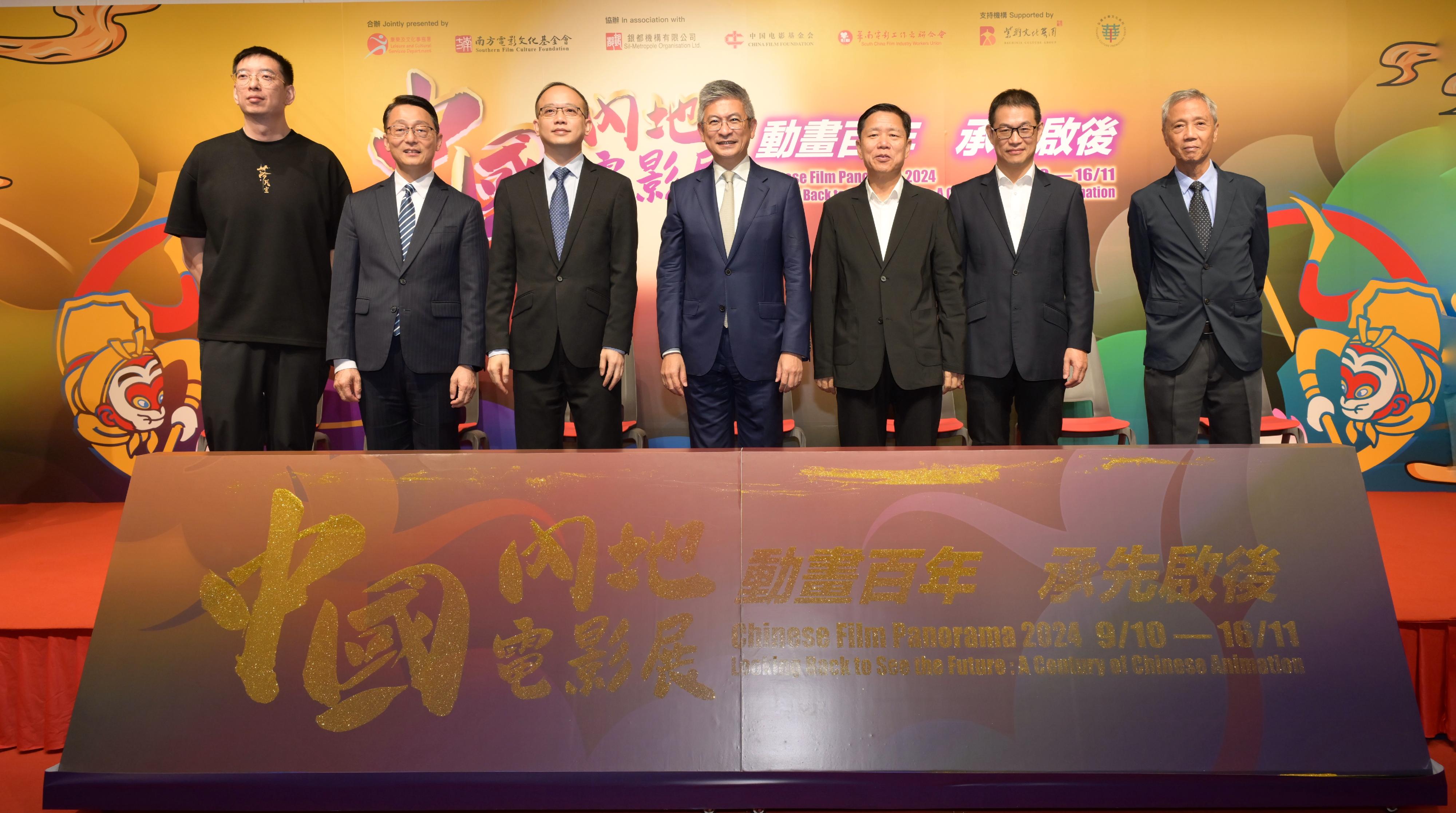 The opening ceremony for the Chinese Film Panorama 2024 was held tonight (October 9) at Hong Kong City Hall. Photo shows the officiating guests (from left) the executive producer of the opening film "Into the Mortal World", Mr Huang Long; the Director of Leisure and Cultural Services, Mr Vincent Liu; the Deputy Director-General of the Department of Publicity, Cultural and Sports Affairs of the Liaison Office of the Central People's Government in the Hong Kong Special Administrative Region, Mr Lin Nan; the Acting Secretary for Culture, Sports and Tourism, Mr Raistlin Lau; the Film and Television Artistic Director of the Bauhinia Culture Group, Mr Deng Wugui; the Chairman of the Southern Film Culture Foundation, Mr Ding Kai; and the Chairman of the South China Film Industry Workers Union, Mr Cheung Hong-tat, at the opening ceremony.