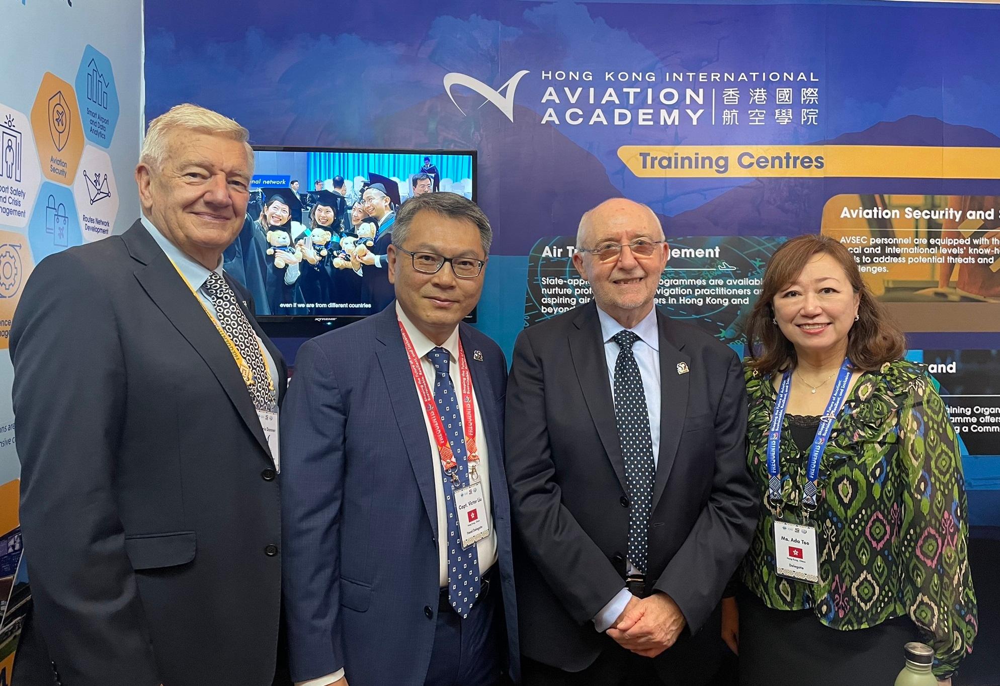 The Director-General of Civil Aviation, Mr Victor Liu (second left) accompanies the President of the International Civil Aviation Organization  Council, Mr Salvatore Sciacchitano (second right), to visit the exhibition booth of the Hong Kong International Aviation Academy (HKIAA), and is pictured with HKIAA representatives during the 59th Conference of Directors General of Civil Aviation, Asia and Pacific Regions, which was held in Cebu, the Philippines, from October 14 to 18.