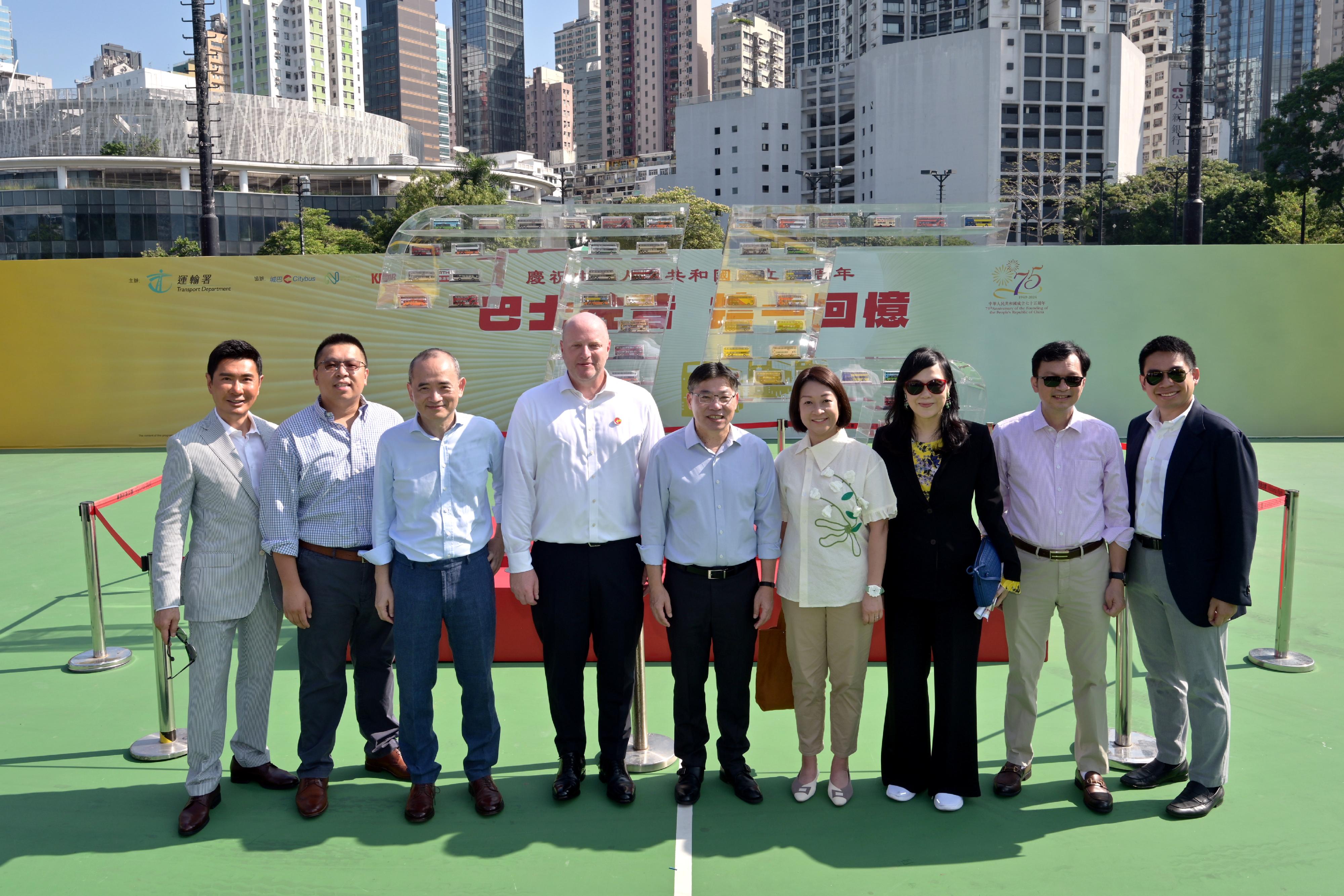 The Secretary for Transport and Logistics, Mr Lam Sai-hung, today (October 19) visited the Bus Exhibition for Celebrating the 75th Anniversary of the Founding of the People's Republic of China organised by the Transport Department. It is one of the highlight events amid National Day celebrations this year. Photo shows Mr Lam (centre); the Under Secretary for Transport and Logistics, Mr Liu Chun-san (second right); the Commissioner for Transport, Ms Angela Lee (fourth right); and guests at the bus model area.