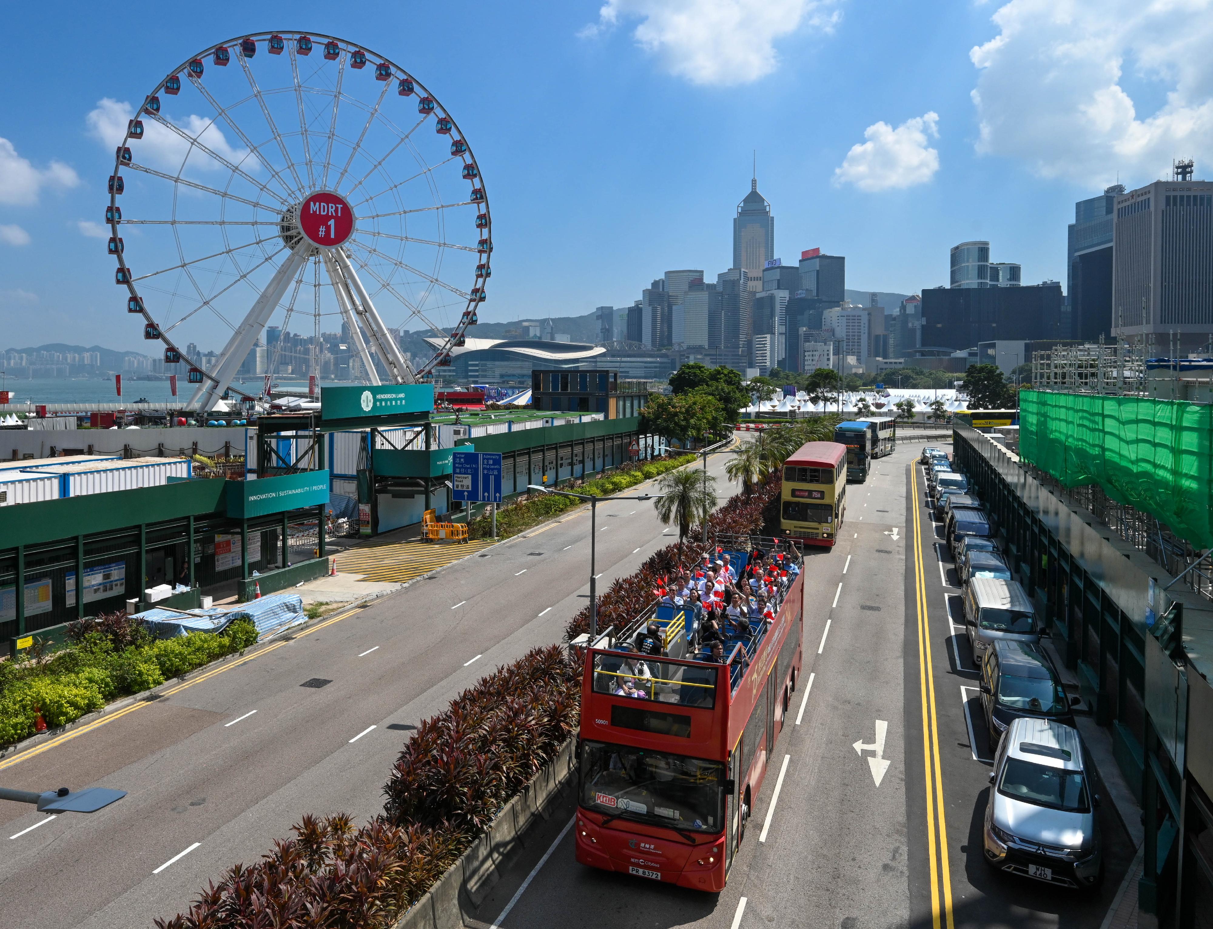 Organised by the Transport Department, the convoy of the Bus Parade for Celebrating the 75th Anniversary of the Founding of the People's Republic of China departed from Victoria Park in Causeway Bay today (October 19). It is one of the highlight events held by the Hong Kong Special Administrative Region Government amid National Day celebrations this year. Photo shows the open-top bus themed on the 75th National Day in Central.