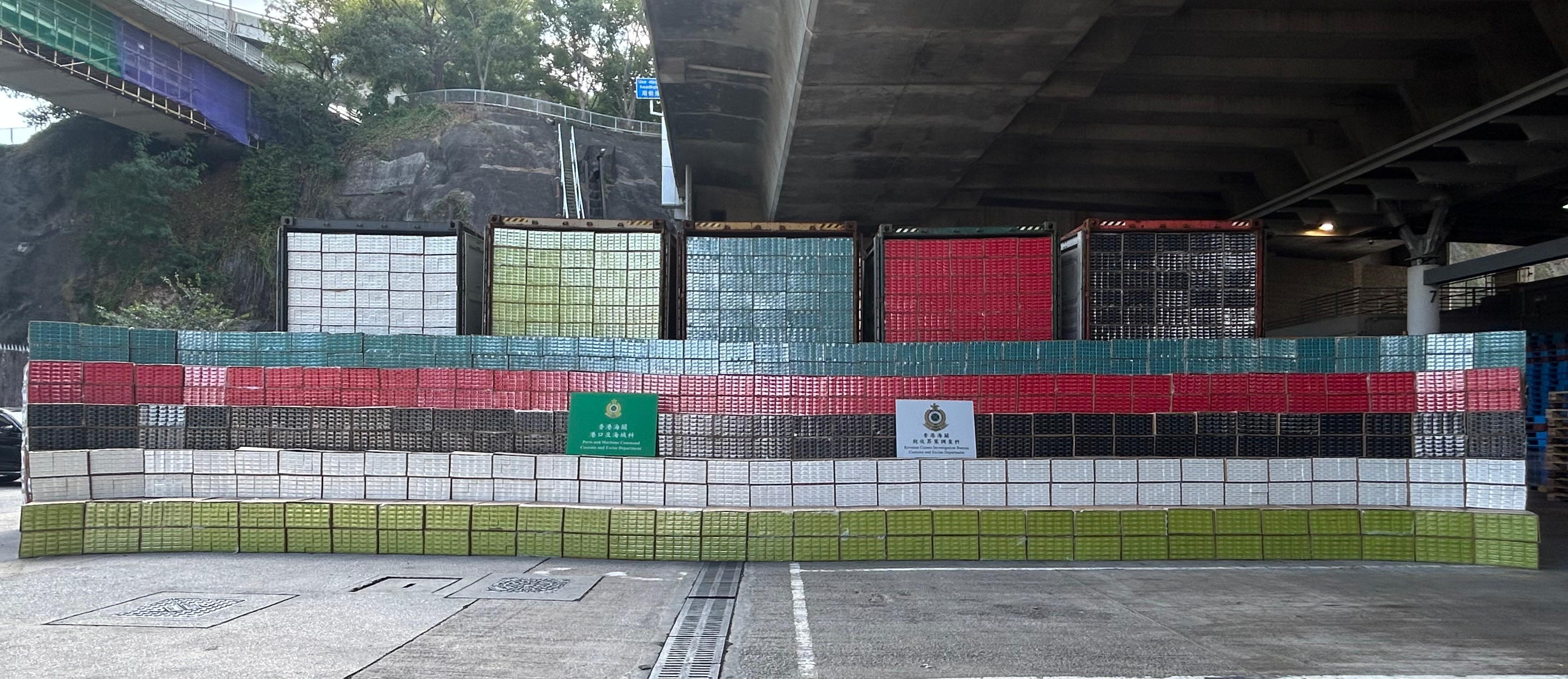 Hong Kong Customs stepped up enforcement to combat illicit cigarette smuggling activities by sea over the past week and detected two related cases involving seaborne containers. A total of about 53 million suspected illicit cigarettes with an estimated market value of about $240 million and a duty potential of about $170 million were seized. Photo shows the suspected illicit cigarettes seized. 