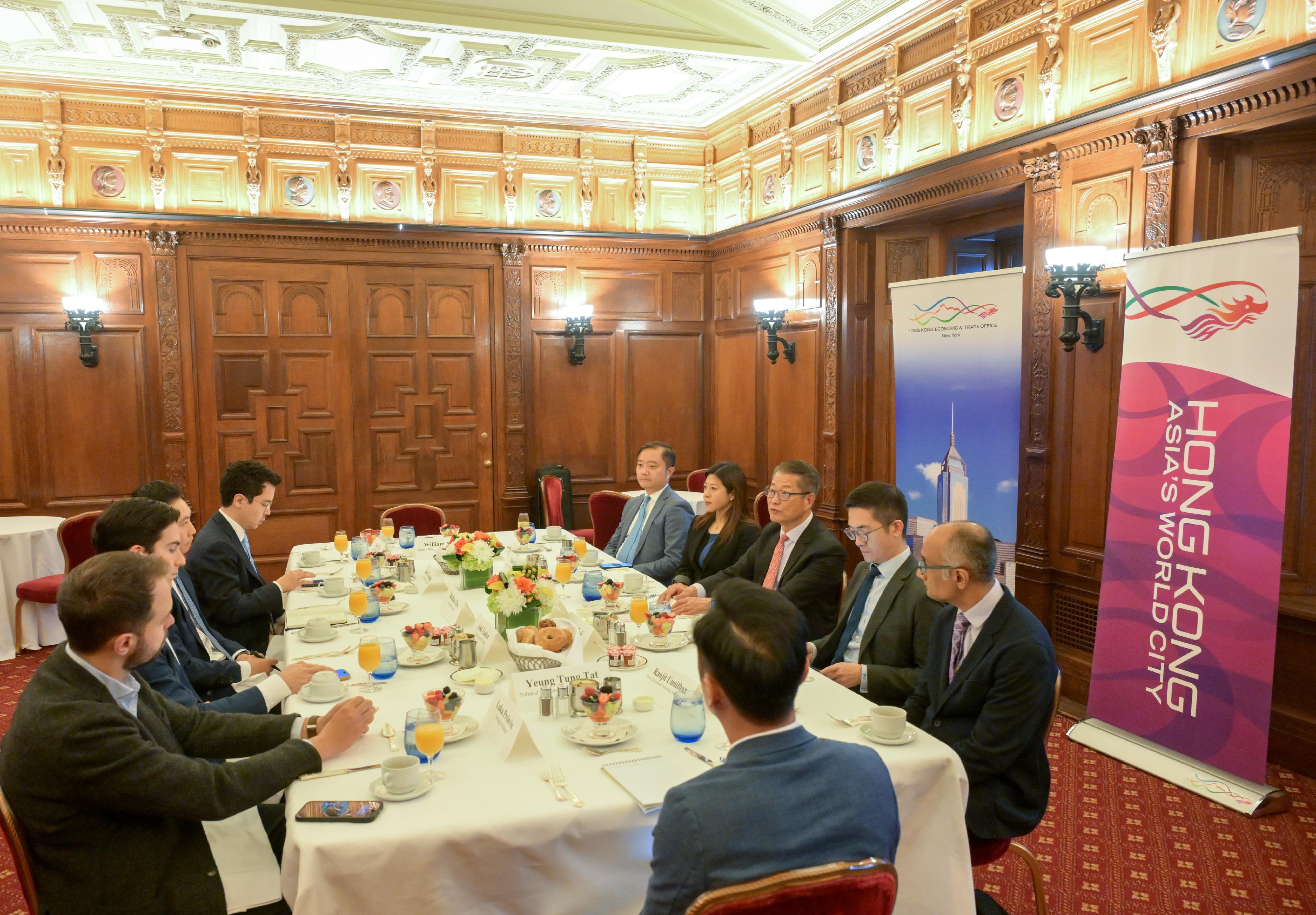 The Financial Secretary, Mr Paul Chan, completed his final day of visit in New York yesterday (October 24, New York time). Photo shows Mr Chan (third right) in a breakfast meeting with representatives from several family offices.