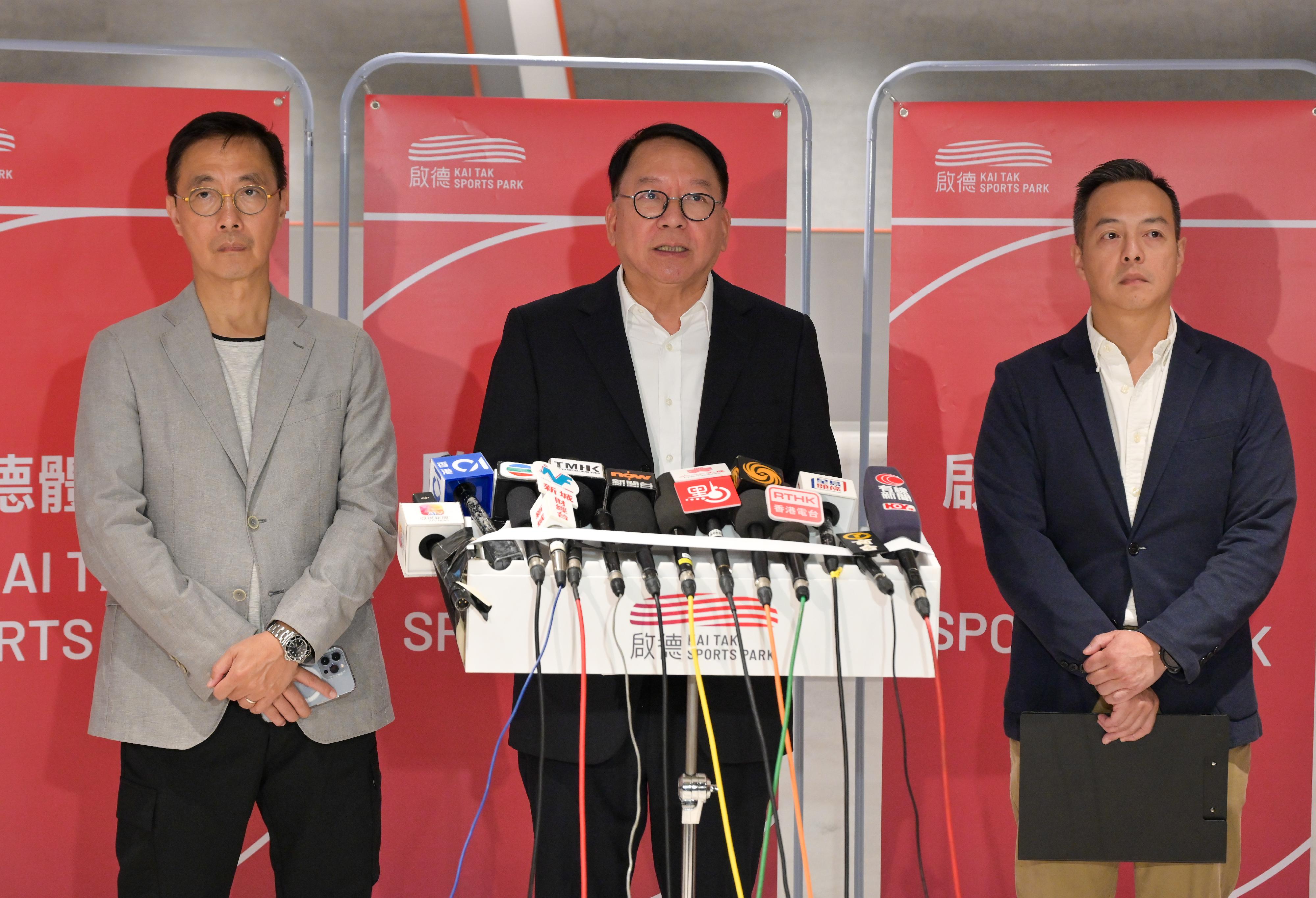 The Chief Secretary for Administration, Mr Chan Kwok-ki (centre), together with the Secretary for Culture, Sports and Tourism, Mr Kevin Yeung (left); and the Deputy Commissioner of Police (Operations) and the Exercise Director of Inter-departmental Task Group on Test and Drills, Mr Chow Yat-ming (right), meets the media after attending the first test event of the Kai Tak Sports Park today (October 27).