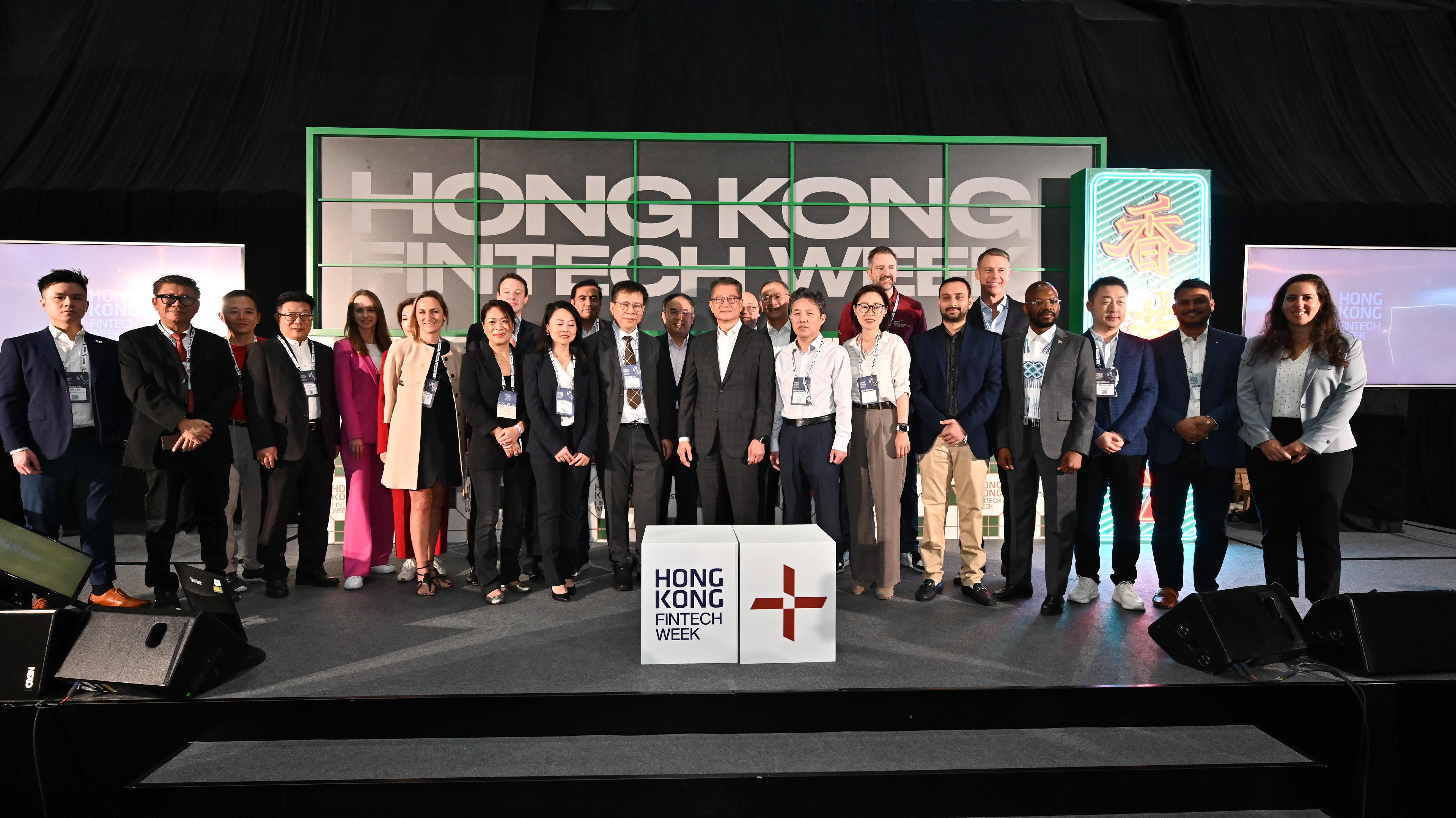 The Financial Secretary, Mr Paul Chan, attended Hong Kong FinTech Week 2024 today (October 28). Photo shows Mr Chan (front row, eighth right) and the Secretary for Financial Services and the Treasury, Mr Christopher Hui (back row, fifth right), with other guests and participants.