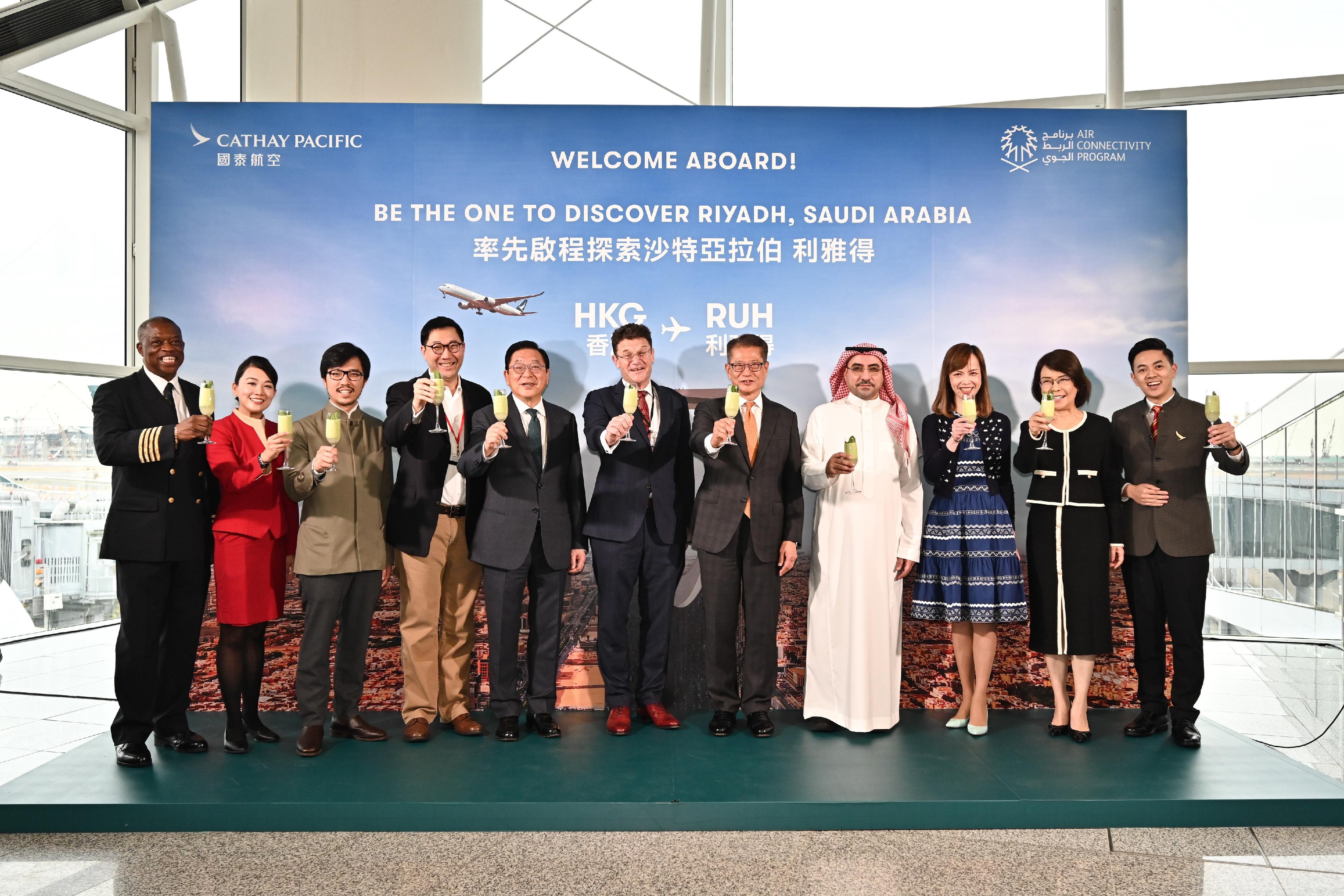 The Financial Secretary, Mr Paul Chan, attended the Cathay Pacific Hong Kong-Riyadh Route Launch Ceremony today (October 28). Photo shows (from third left) the Commissioner for Belt and Road, Mr Nicholas Ho; the Chairman of the Financial Services Development Council, Mr Laurence Li; Executive Council Member Mr Jeffrey Lam; the Chairman of the Cathay Pacific Group, Mr Patrick Healy; Mr Chan; the Consul General of Saudi Arabia in Hong Kong, Mr Hamad Aljebreen; the Chief Customer and Commercial Officer of Cathay Pacific, Ms Lavinia Lau; and the Acting Chief Executive Officer of the Airport Authority Hong Kong, Mrs Vivian Cheung, proposing a toast.  