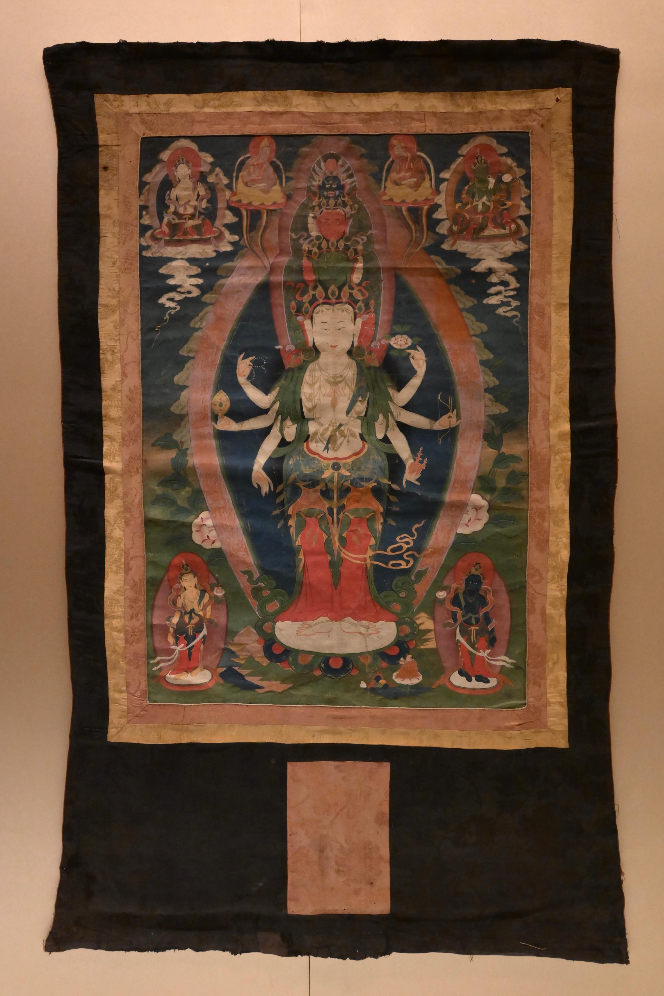 The opening ceremony of the exhibition "Buddhist Pilgrimage: Treasures from the Donation of The Tsui Art Foundation" was held today (October 29) at the Hong Kong Heritage Museum. Photo shows thangka "Eleven-faced Avalokiteśvara", which depicts an Avalokiteśvara with eight arms. The first pair of hands is      held together in front of the chest, holding a precious jewel. The three hands on the right hold crystal beads, the Wheel of the Law, and the lower hand is in the "abhaya mudrā". On the left, the hands hold a lotus, a bow and arrows, as well as a kuṇḍikā.
