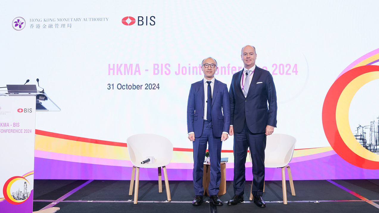 The Deputy Head of Monetary and Economic Department and Head of Financial Stability Policy of the Bank for International Settlements, Mr Gaston Gelos (right), moderates a presentation titled "Tokenisation and platforms: implications for efficiency and stability" by the Deputy Director, Monetary and Capital Markets Department of the International Monetary Fund, Dr Dong He (left) at the HKMA-BIS Joint Conference 2024 today (October 31) . 