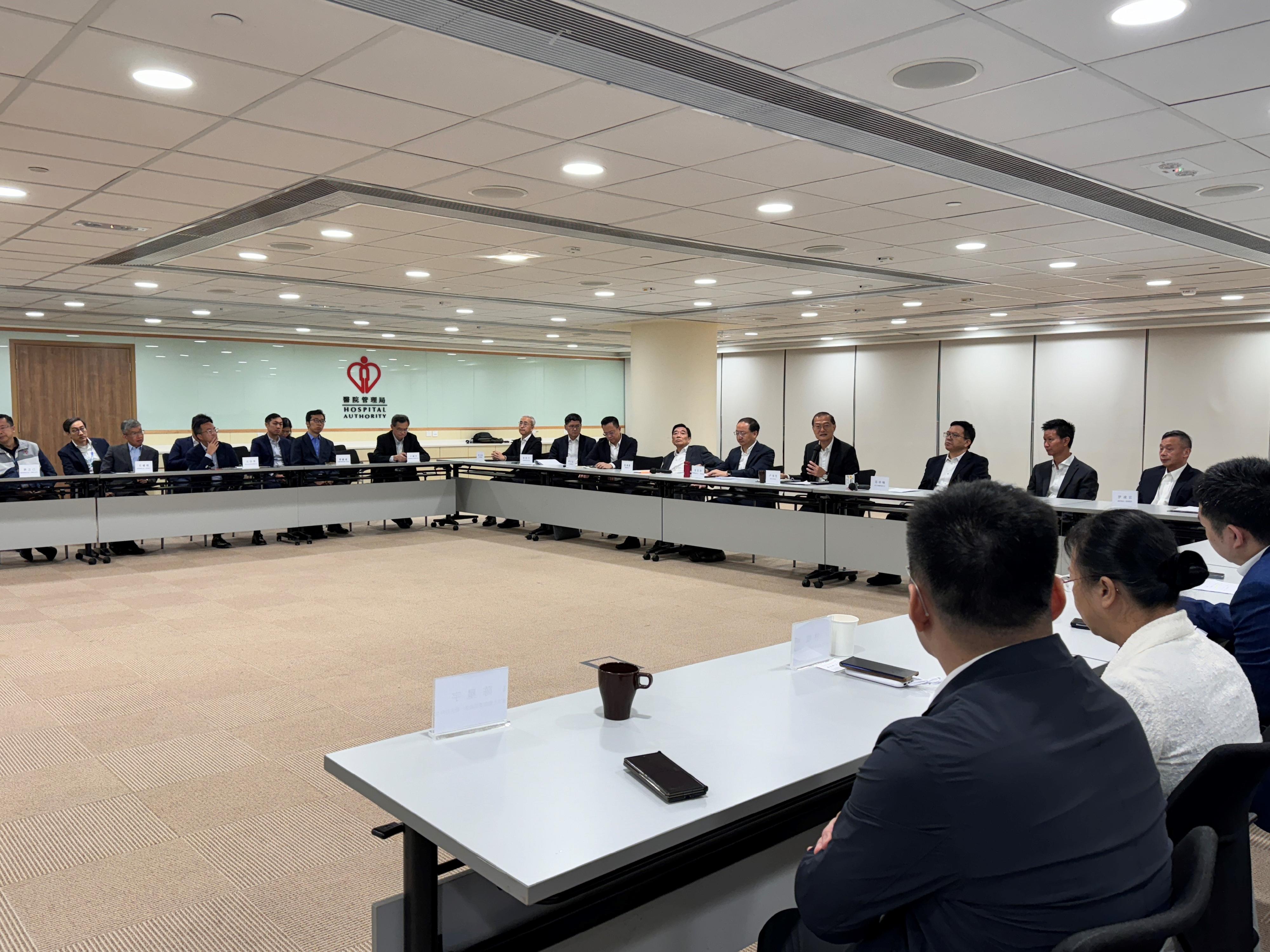 The Hong Kong Special Administrative Region (HKSAR) Government today (October 31) conducted the second drill for the Pilot Scheme for Direct Cross-boundary Ambulance Transfer in the Greater Bay Area in collaboration with the Guangdong Provincial Government and the Shenzhen Municipal Government. Photo shows the Secretary for Health, Professor Lo Chung-mau (fourth right); Deputy Director-General and Level I Bureau Rank Official of the Hong Kong and Macao Affairs Office of the People's Government of Guangdong Province Mr Zhang Zhihua (fifth right); Deputy Director-General of the Health Commission of Guangdong Province Mr Deng Linfeng (third right), Deputy Director of the Public Hygiene and Health Commission of Shenzhen Municipality Mr Li Jieyun (seventh right); Deputy Secretary for Health Mr Sam Hui (second right); the Chairman of the Hospital Authority (HA), Mr Henry Fan (sixth right); and the Chief Executive of the HA, Dr Tony Ko (eighth right), attending the Guangdong-Shenzhen-Hong Kong inter-departmental meeting and listened to reports from relevant representatives of the HKSAR Government, the Guangdong Provincial Government and the Shenzhen Municipal Government on the flow of the drill.