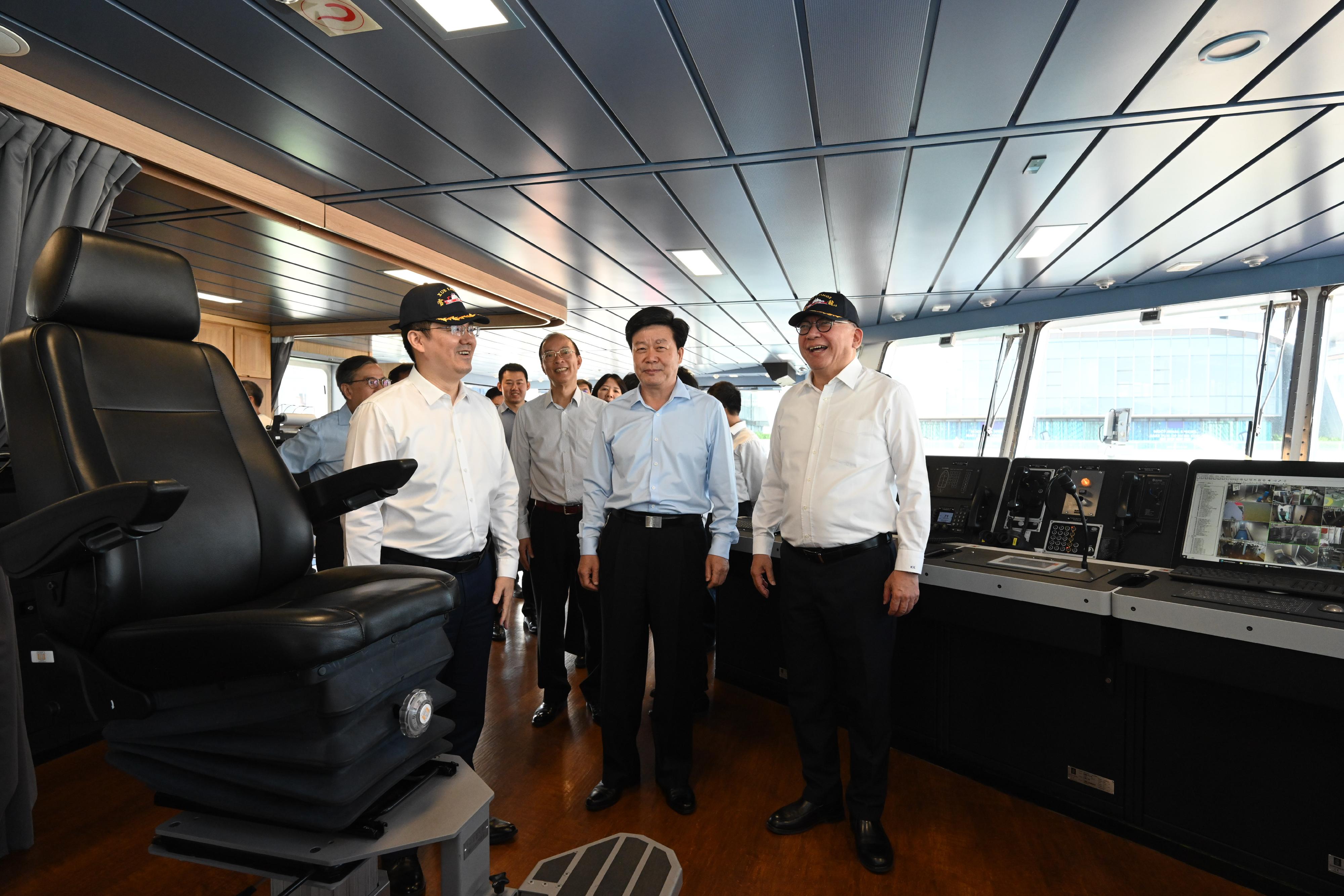 The Chief Secretary for Administration, Mr Chan Kwok-ki, attended the send-off event of China's 41st Antarctic expedition team in Guangzhou today (November 1). Photo shows (first row, from left) the Mayor of the Guangzhou Municipal Government, Mr Sun Zhiyang; Vice Minister of the Ministry of Natural Resources Mr Sun Shuxian; Mr Chan, and other guests touring the vessel Xuelong 2.