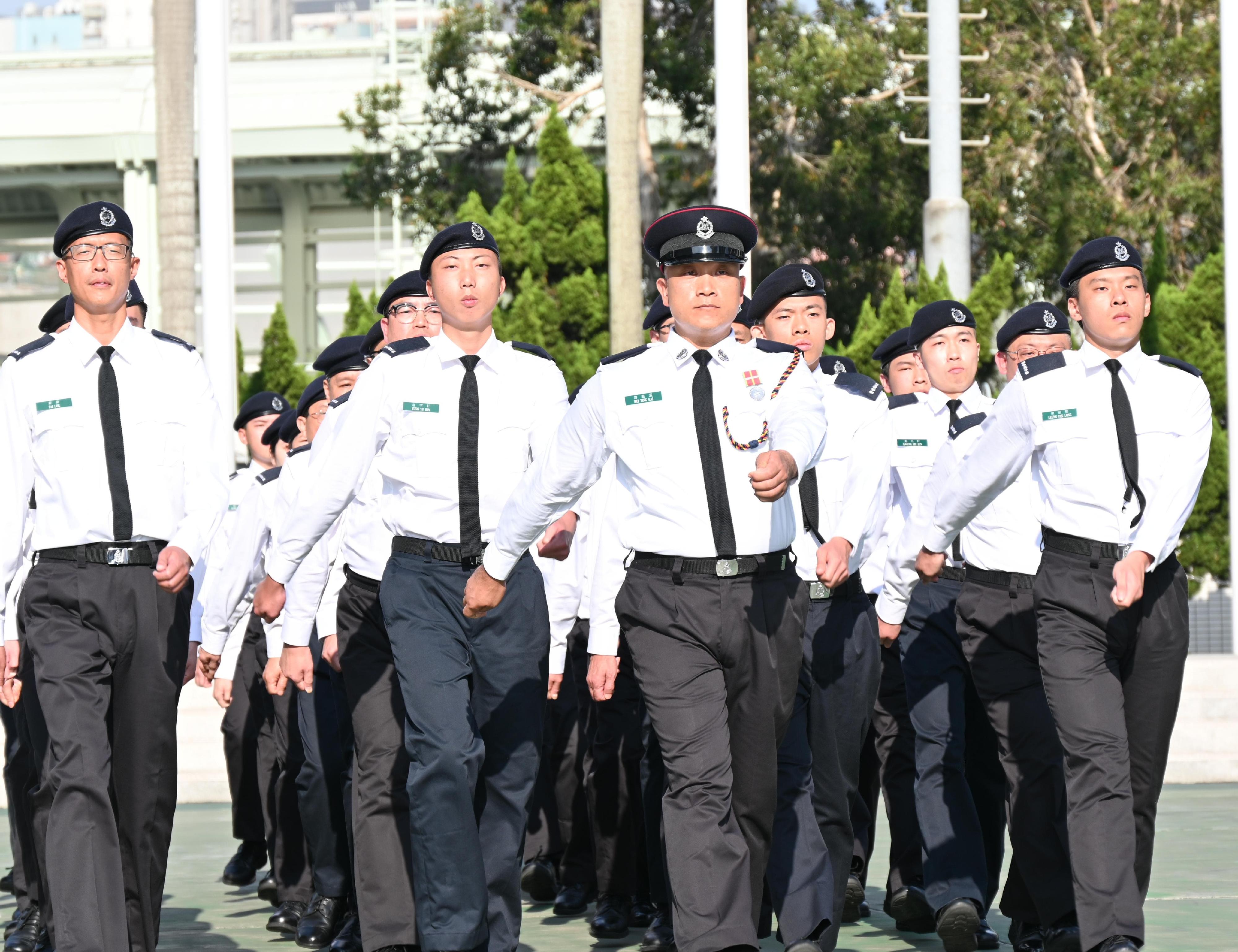 The Auxiliary Medical Service held a passing-out parade today (November 3), where the 287 new members were reviewed by the Secretary for Security, Mr Tang Ping-keung. Photo shows passing-out members performing a foot drill.
