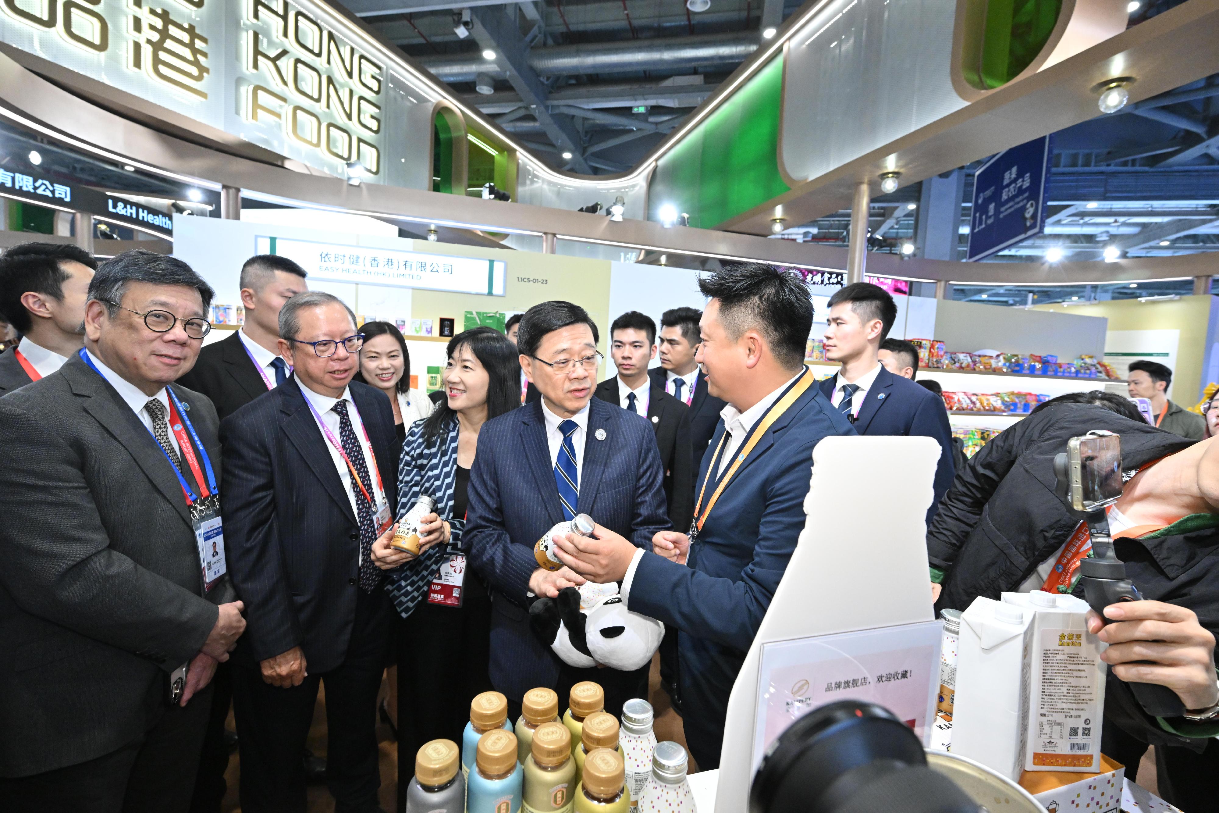 The Chief Executive, Mr John Lee, toured the seventh China International Import Expo in Shanghai today (November 5). Photo shows Mr Lee (front row, second right) visiting the Hong Kong Product Pavilion and interacting with exhibitors.