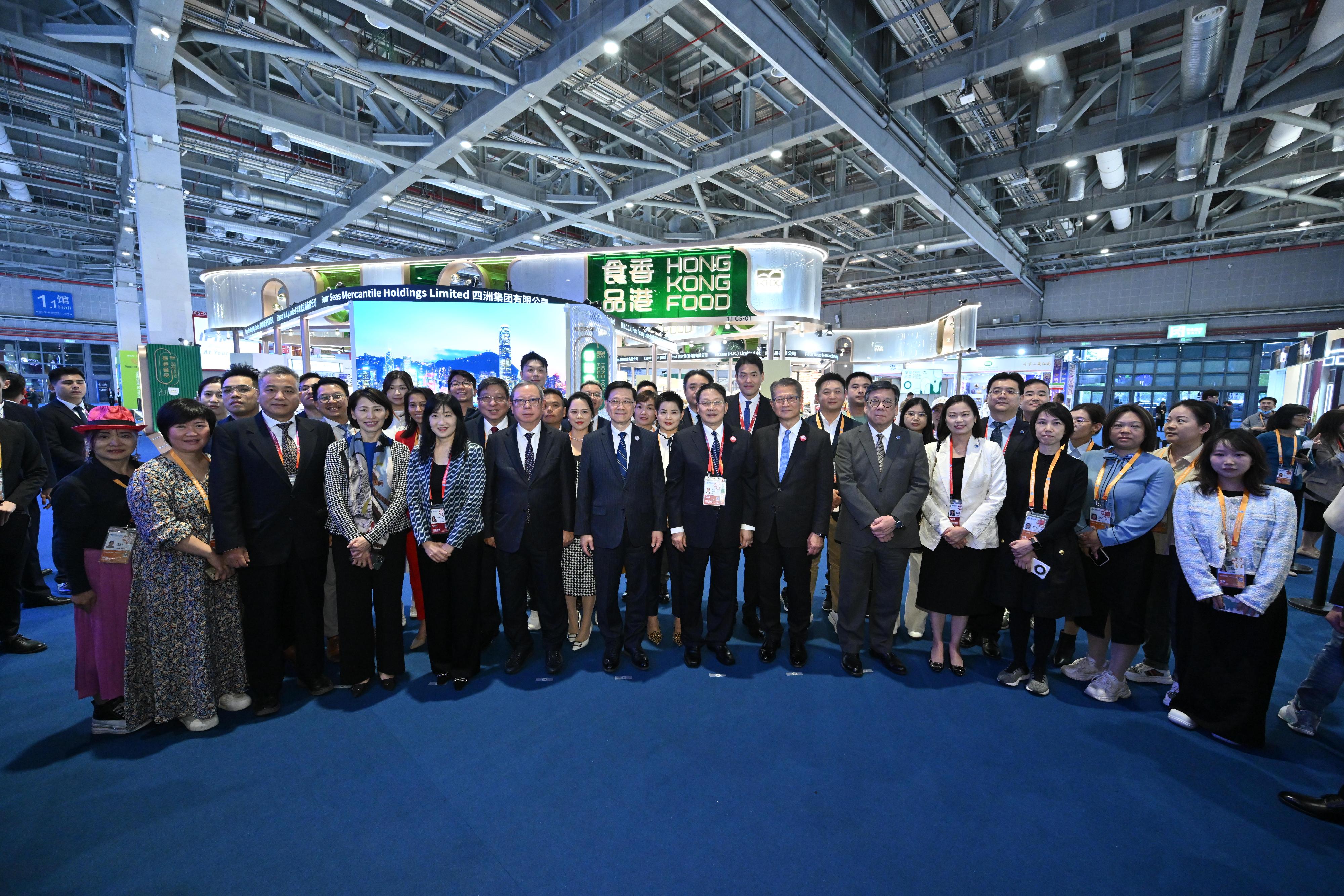 The Chief Executive, Mr John Lee, toured the seventh China International Import Expo in Shanghai today (November 5). Photo shows (front row, from fourth left) the Director of the Chief Executive's Office, Ms Carol Yip; the Executive Director of the Hong Kong Trade Development Council (HKTDC), Ms Margaret Fong; the Chairman of the HKTDC, Dr Peter Lam; Mr Lee; Deputy Director of the Liaison Office of the Central People's Government in the Hong Kong Special Administrative Region Mr Yin Zonghua; the Financial Secretary, Mr Paul Chan; the Secretary for Commerce and Economic Development, Mr Algernon Yau; the Permanent Secretary for Commerce and Economic Development, Ms Maggie Wong; and other guests at the Hong Kong Product Pavilion.