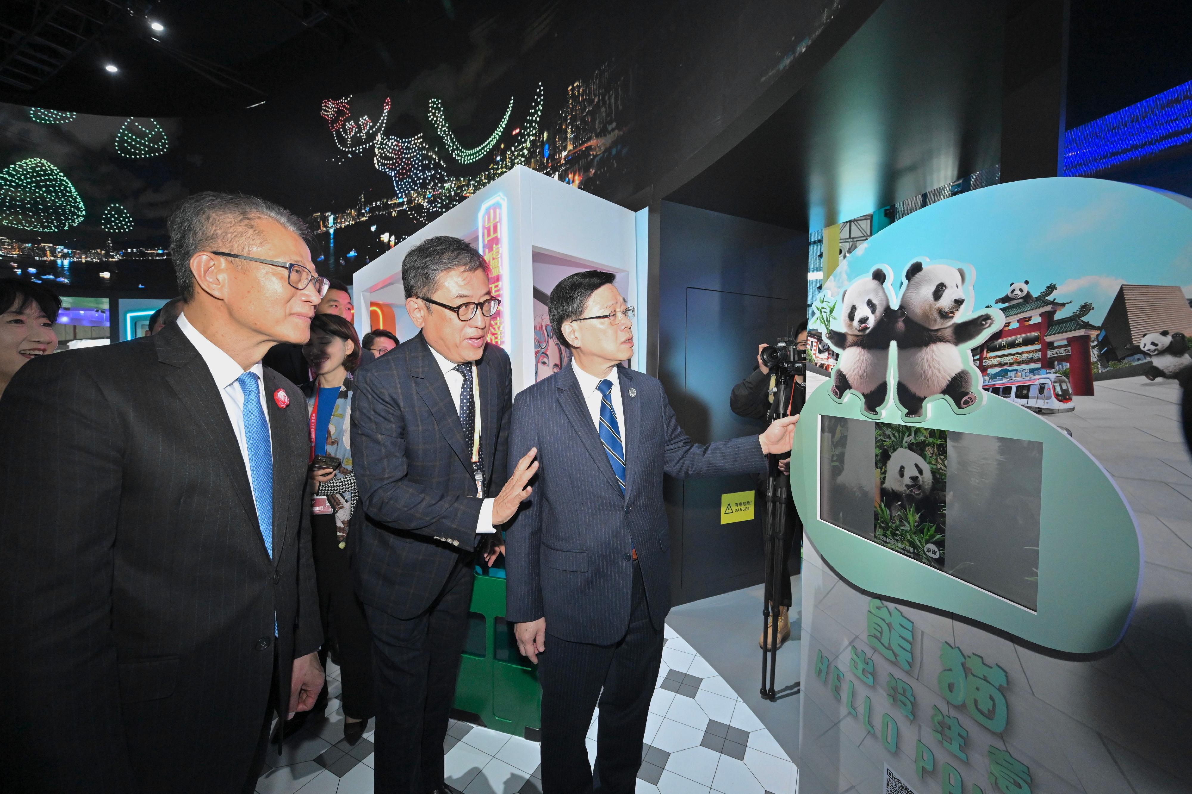 The Chief Executive, Mr John Lee, toured the seventh China International Import Expo in Shanghai today (November 5). Photo shows Mr Lee (first right) visiting the pavilion of Hong Kong Tourism Board and interacting with exhibitors. Looking on are the Financial Secretary, Mr Paul Chan (first left); and the Executive Director of the Hong Kong Tourism Board, Mr Dane Cheng (centre).