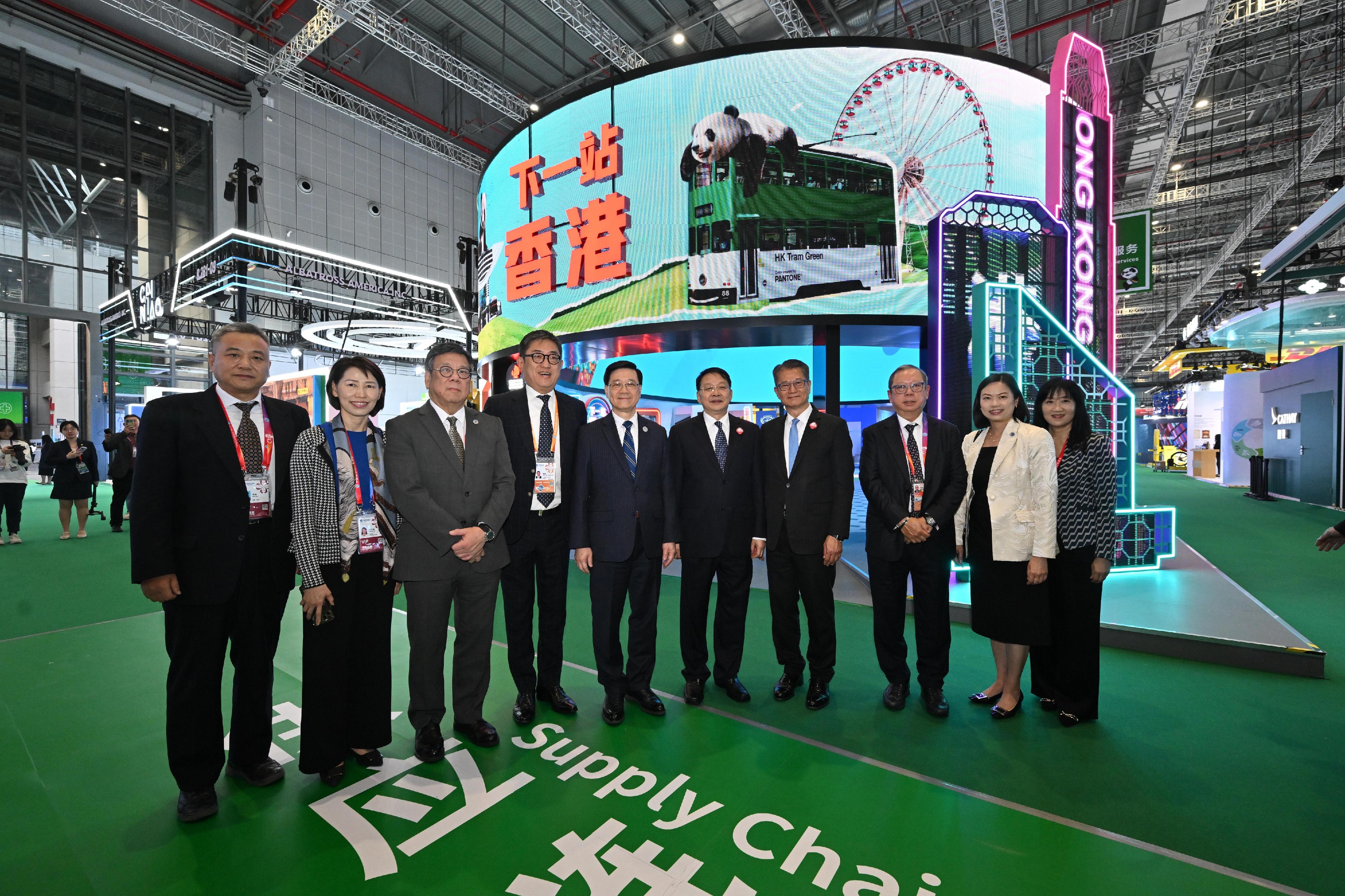 The Chief Executive, Mr John Lee, toured the seventh China International Import Expo in Shanghai today (November 5). Photo shows (from second left) the Director of the Chief Executive's Office, Ms Carol Yip; the Secretary for Commerce and Economic Development, Mr Algernon Yau; the Executive Director of the Hong Kong Tourism Board, Mr Dane Cheng; Mr Lee; Deputy Director of the Liaison Office of the Central People's Government in the Hong Kong Special Administrative Region Mr Yin Zonghua; the Financial Secretary, Mr Paul Chan; the Chairman of the Hong Kong Trade Development Council, Dr Peter Lam; the Permanent Secretary for Commerce and Economic Development, Ms Maggie Wong; the Executive Director of the Hong Kong Trade Development Council, Ms Margaret Fong; and other guests at the pavilion of Hong Kong Tourism Board.