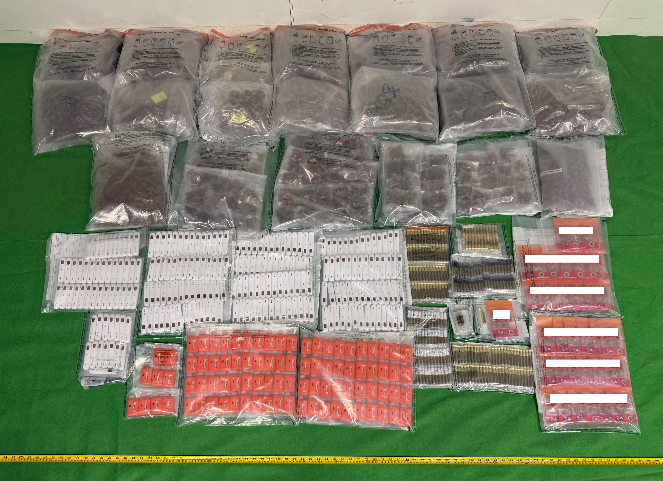 Hong Kong Customs yesterday (November 7) seized a total of about 10 kilograms of suspected cannabis buds, 2kg of gummy candies containing suspected tetrahydro-cannabinol (THC) and 539 vape sticks containing suspected THC, with a total estimated market value of about $2.5 million, in Yuen Long. Photo shows the suspected drugs seized.