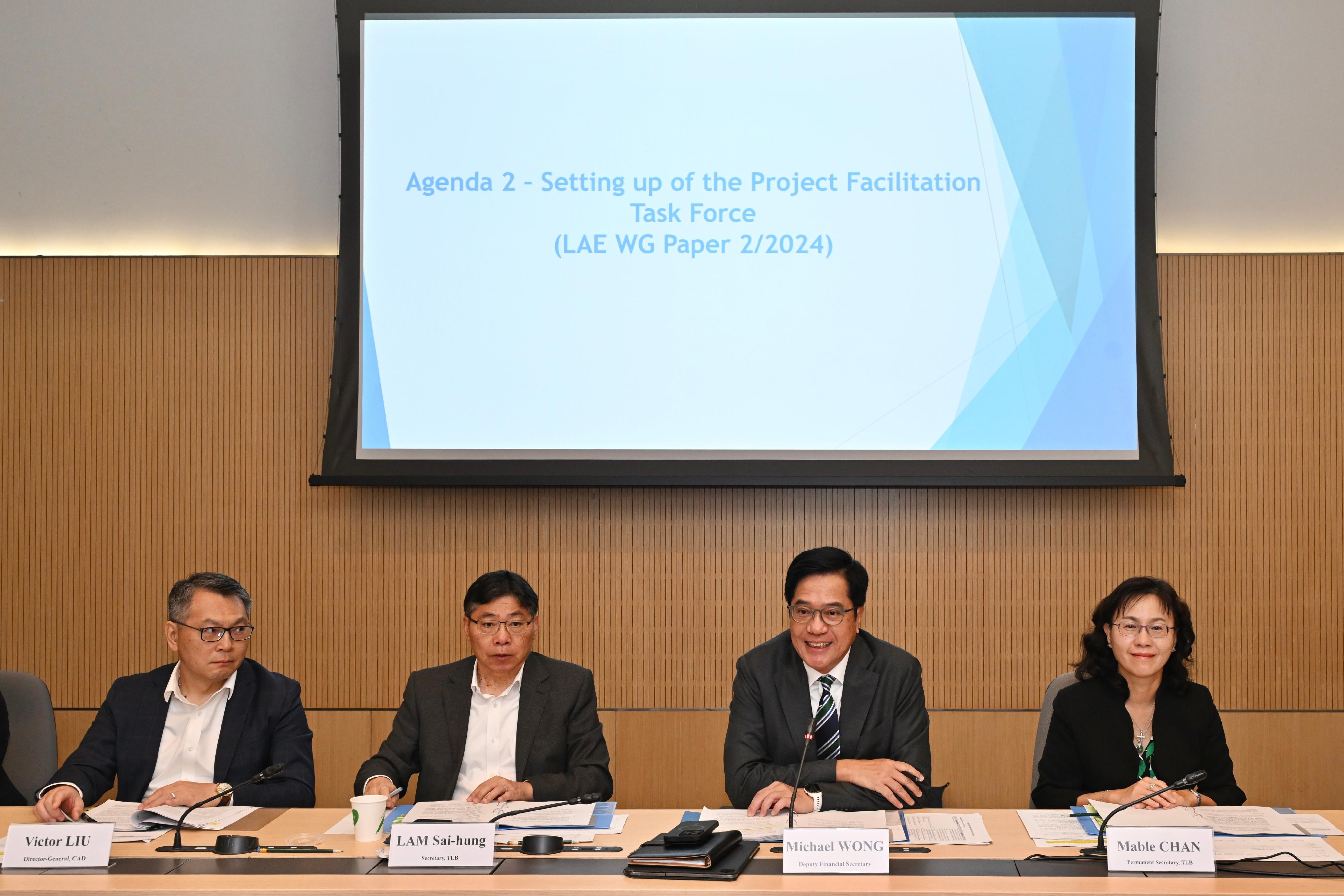 The Deputy Financial Secretary, Mr Michael Wong (second right), convened the first meeting as the Head of the Working Group on Developing Low-altitude Economy today (November 12). Also present are the Secretary for Transport and Logistics, Mr Lam Sai-hung (second left); the Permanent Secretary for Transport and Logistics, Ms Mable Chan (first right); and the Director-General of Civil Aviation, Mr Victor Liu (first left).