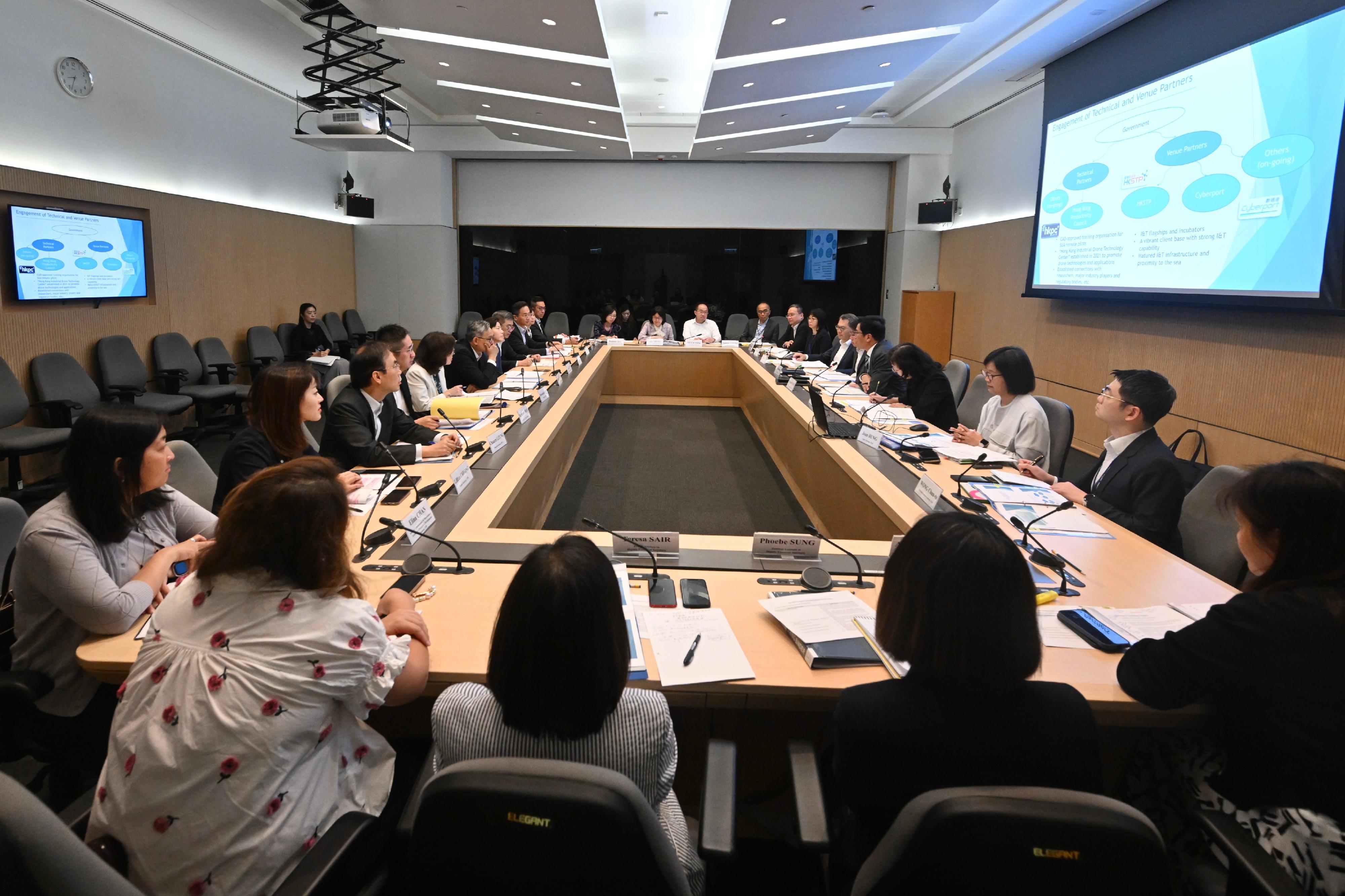 The Deputy Financial Secretary, Mr Michael Wong (fourth right), convened the first meeting as the Head of the Working Group on Developing Low-altitude Economy today (November 12) and discussed the overall strategies and work plan for developing the low-altitude economy with the Secretary for Transport and Logistics, Mr Lam Sai-hung (fifth right); the Secretary for Development, Ms Bernadette Linn (fifth left); the Acting Secretary for Security, Mr Michael Cheuk (sixth left); the Acting Secretary for Commerce and Economic Development, Dr Bernard Chan (fourth left); the Acting Secretary for Innovation, Technology and Industry, Ms Lillian Cheong (second left); the Commissioner of Customs and Excise, Ms Louise Ho (seventh left); the Permanent Secretary for Transport and Logistics, Ms Mable Chan (third right); the Director-General of Civil Aviation, Mr Victor Liu (sixth right), and other Heads of Departments.