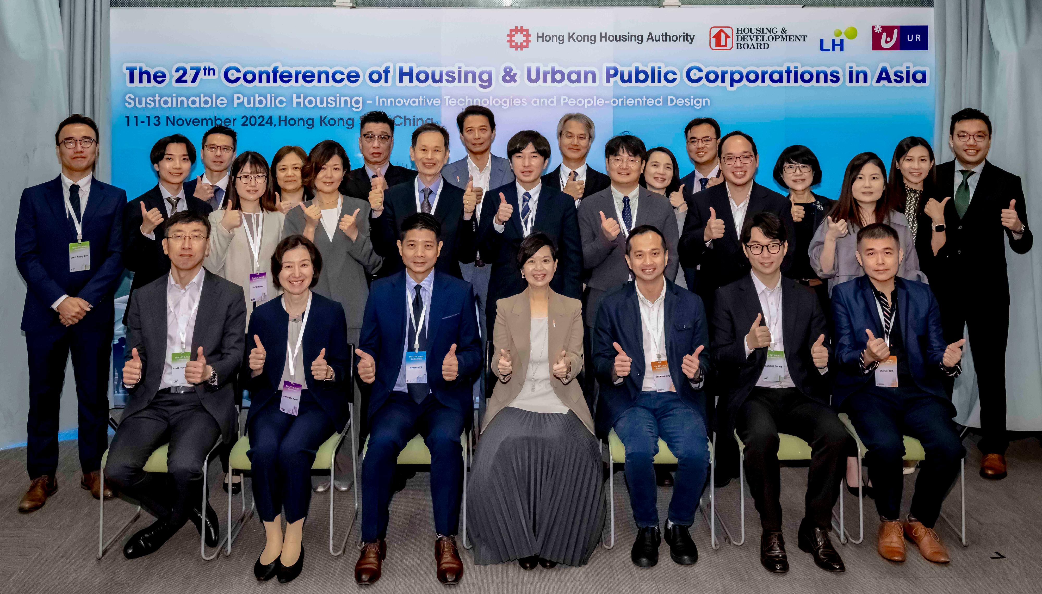 The 27th Conference of the Housing and Urban Public Corporations in Asia (A-HUC) hosted by the Hong Kong Housing Authority (HA), concluded today (November 13). Photo shows the Secretary for Housing, Ms Winnie Ho  (front row, middle), Assistant Director of Housing (Development and Procurement) Mr Sherman Yip, (front row, fifth right) and delegates from the four public housing authorities in Asia, namely the Housing and Development Board of Singapore, the Korea Land and Housing Corporation, the Urban Renaissance Agency of Japan and the HA on the second day (November 12) of the A-HUC Conference.