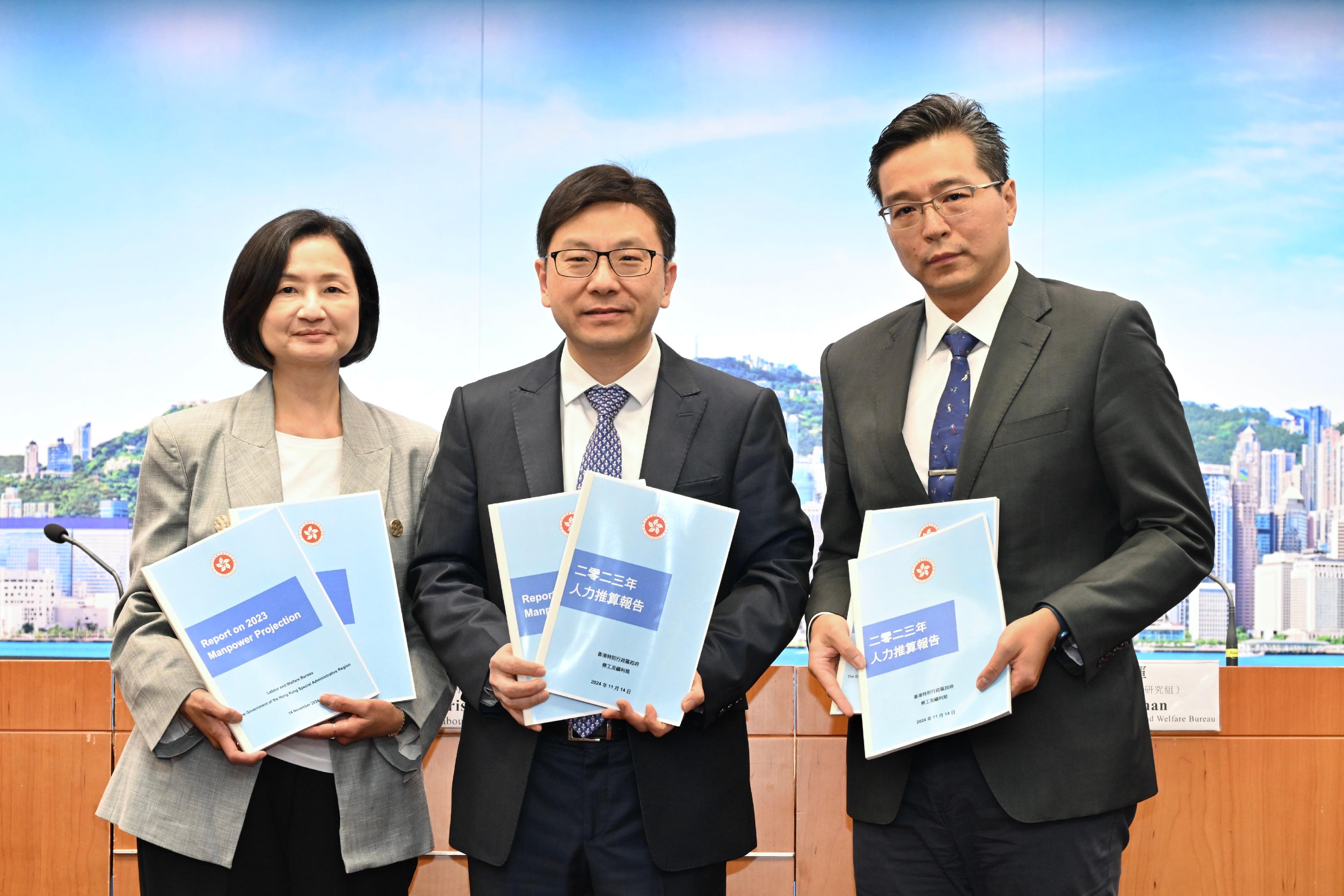 The Secretary for Labour and Welfare, Mr Chris Sun (centre), chaired a press conference today (November 14) on the Report on 2023 Manpower Projection to give a brief account on its major findings. The Deputy Secretary for Labour and Welfare (Manpower), Ms Angelina Kwan (left), and the Head (Research Unit) of the Labour and Welfare Bureau, Mr Roy Chan (right), also attended.