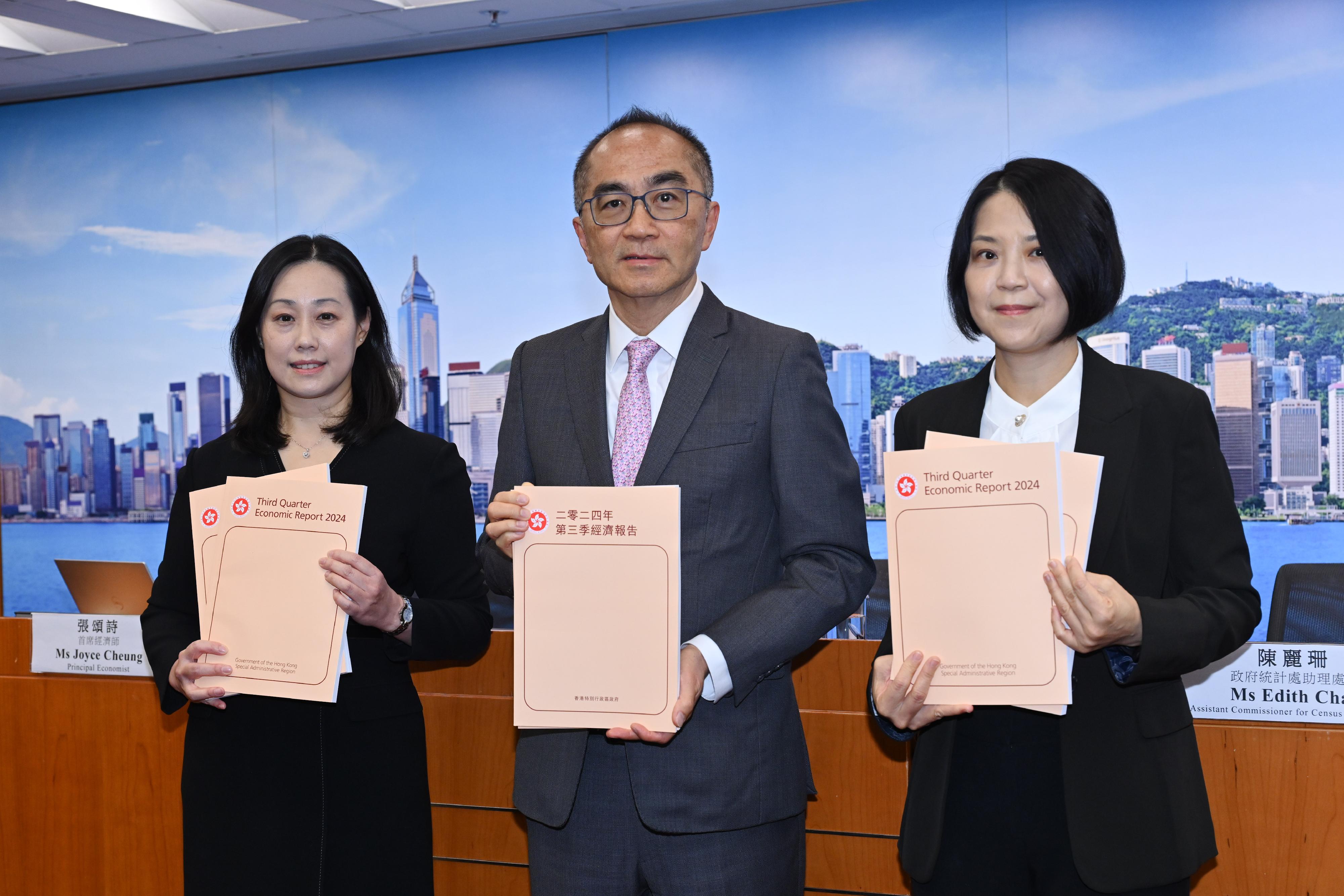 The Government Economist, Mr Adolph Leung (centre), presents the Third Quarter Economic Report 2024 at a press conference today (November 15). Also present are Principal Economist Ms Joyce Cheung (left) and Assistant Commissioner for Census and Statistics Ms Edith Chan (right).