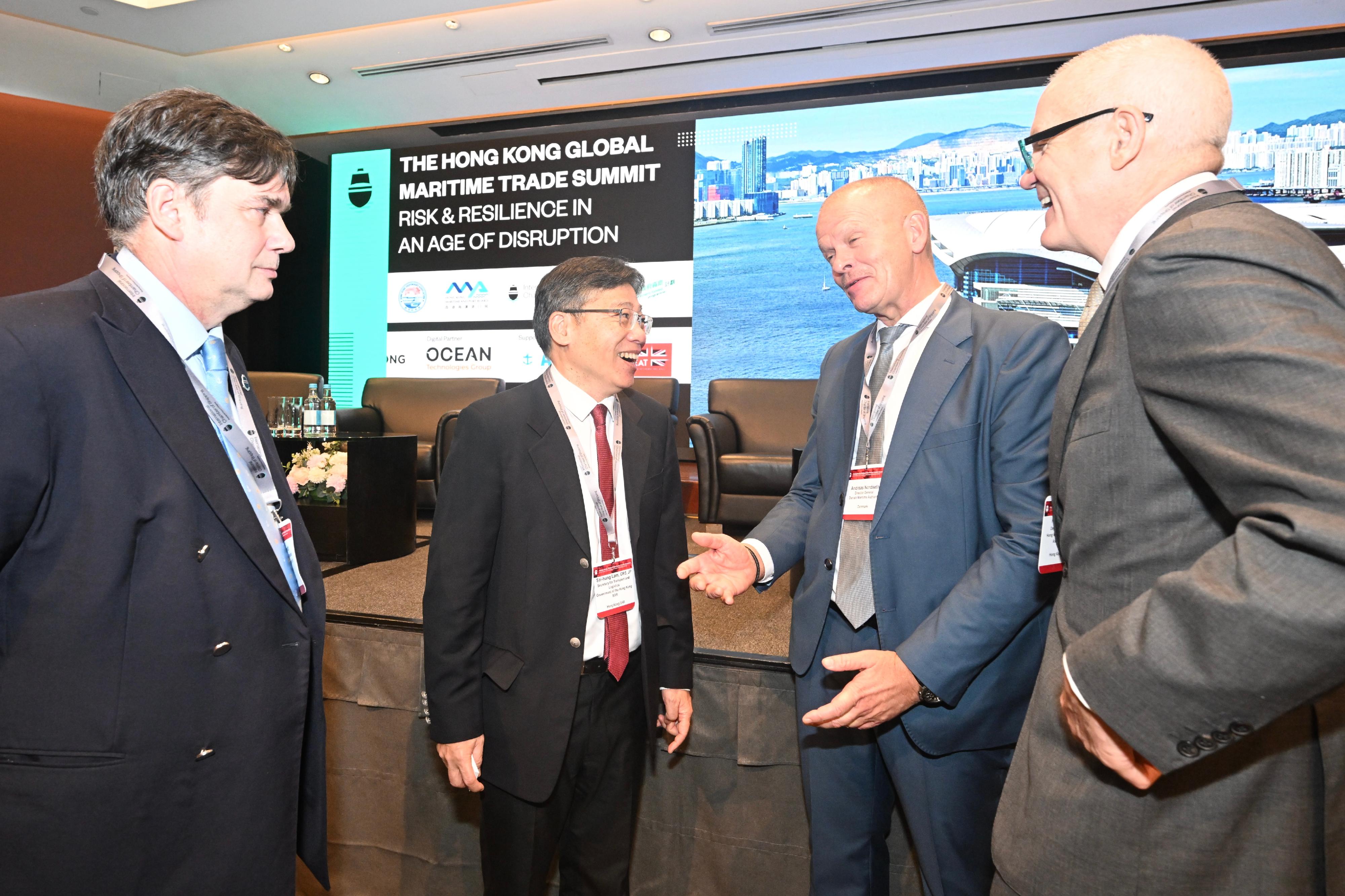 The Secretary for Transport and Logistics, Mr Lam Sai-hung, attended the Hong Kong Global Maritime Trade Summit organised by the International Chamber of Shipping today (November 18). Photo shows Mr Lam (second left) exchanging views with guests at the Summit.