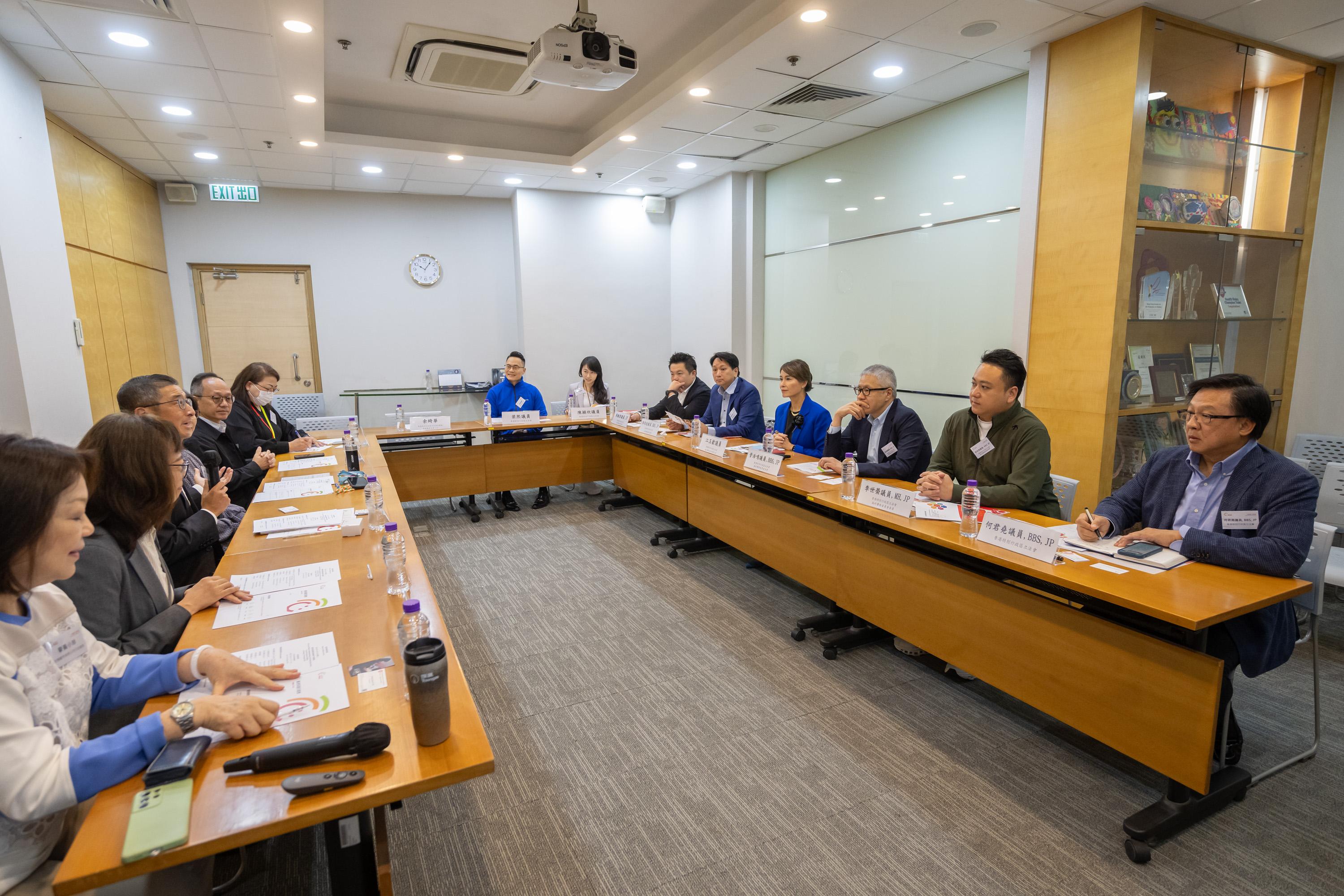 The Legislative Council (LegCo) Panel on Welfare Services visits the Hong Kong Society for the Protection of Children (HKSPC) and its Children’s Residential Home today (November 19). Photo shows the Chairman of the Panel, Reverend Canon Peter Douglas Koon (third right), and other Members receiving a briefing from HKSPC representatives on its services and operations.