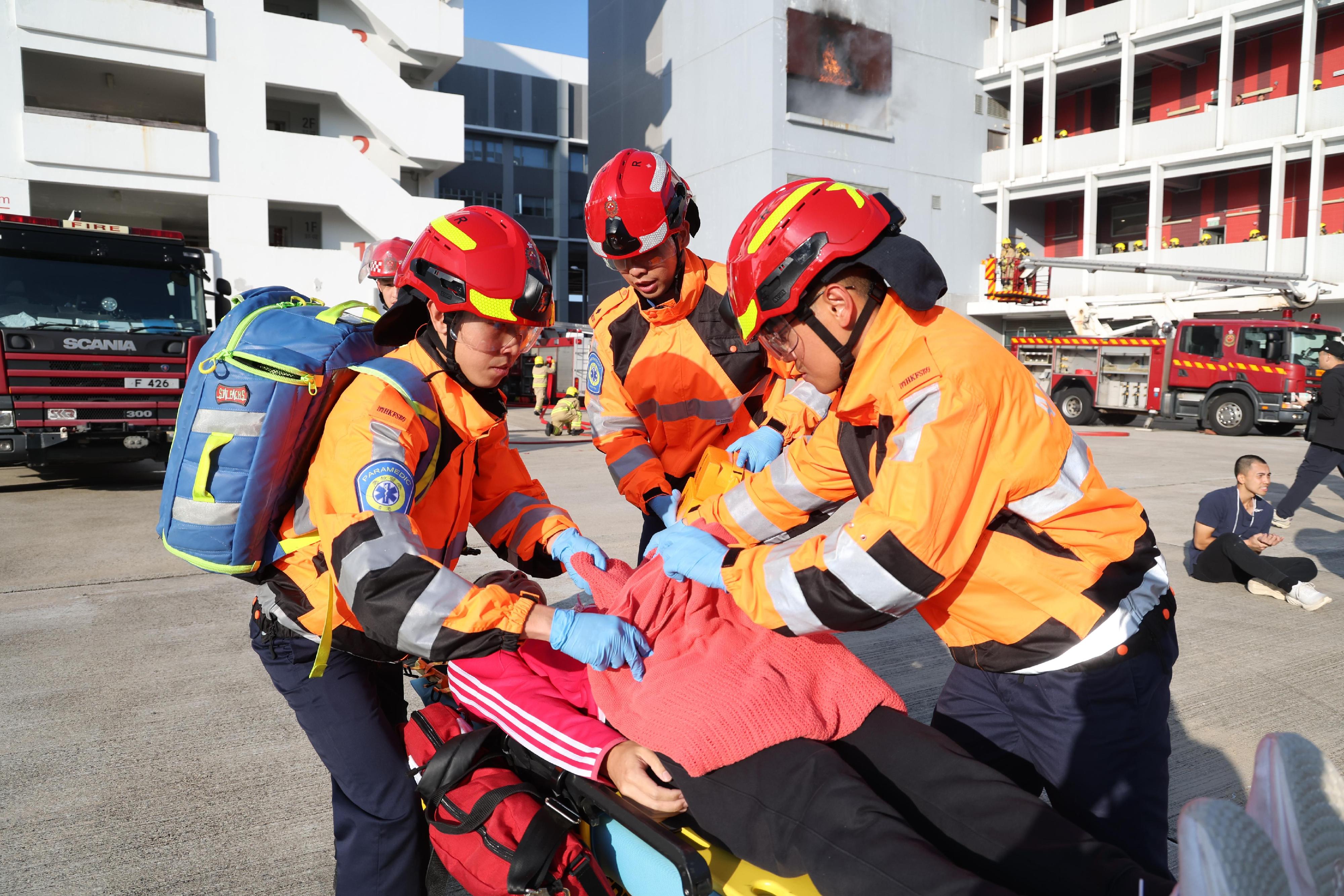 The Secretary for Housing, Ms Winnie Ho, reviewed the Fire Services passing-out parade at the Fire and Ambulance Services Academy today (November 22). Photo shows graduates demonstrating rescue techniques.