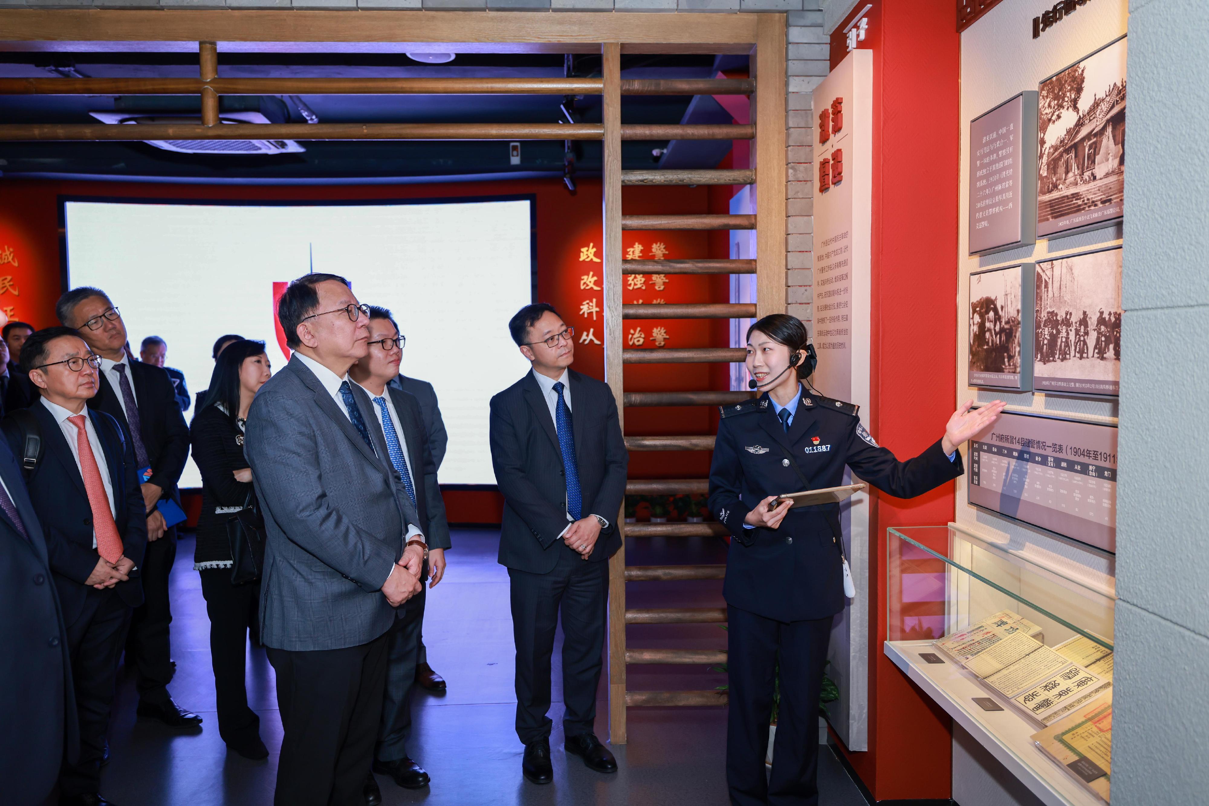 The Chief Secretary for Administration and Chairman of the Fight Crime Committee (FCC), Mr Chan Kwok-ki, today (November 22) led members of the FCC and chairpersons of the District Fight Crime Committees on a study and exchange tour on the prevention and fighting of crime in Guangzhou. Photo shows Mr Chan (second left) and the delegation visiting the police history museum of the Guangdong Provincial Public Security Department.