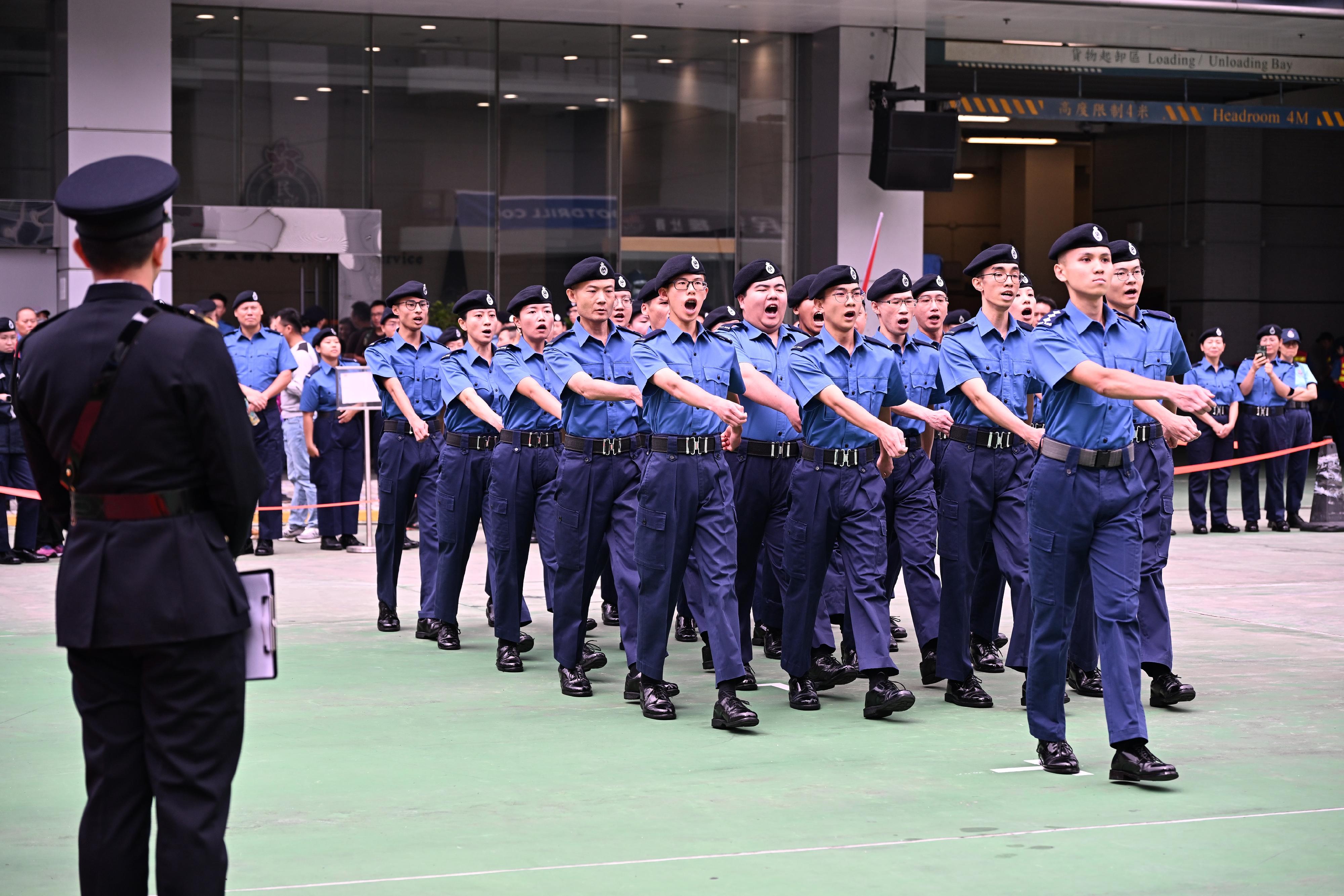 The Civil Aid Service held the Foot Drill Competition 2024 today (November 24).  Photo shows a participating team performing a foot drill with synchronised movements.