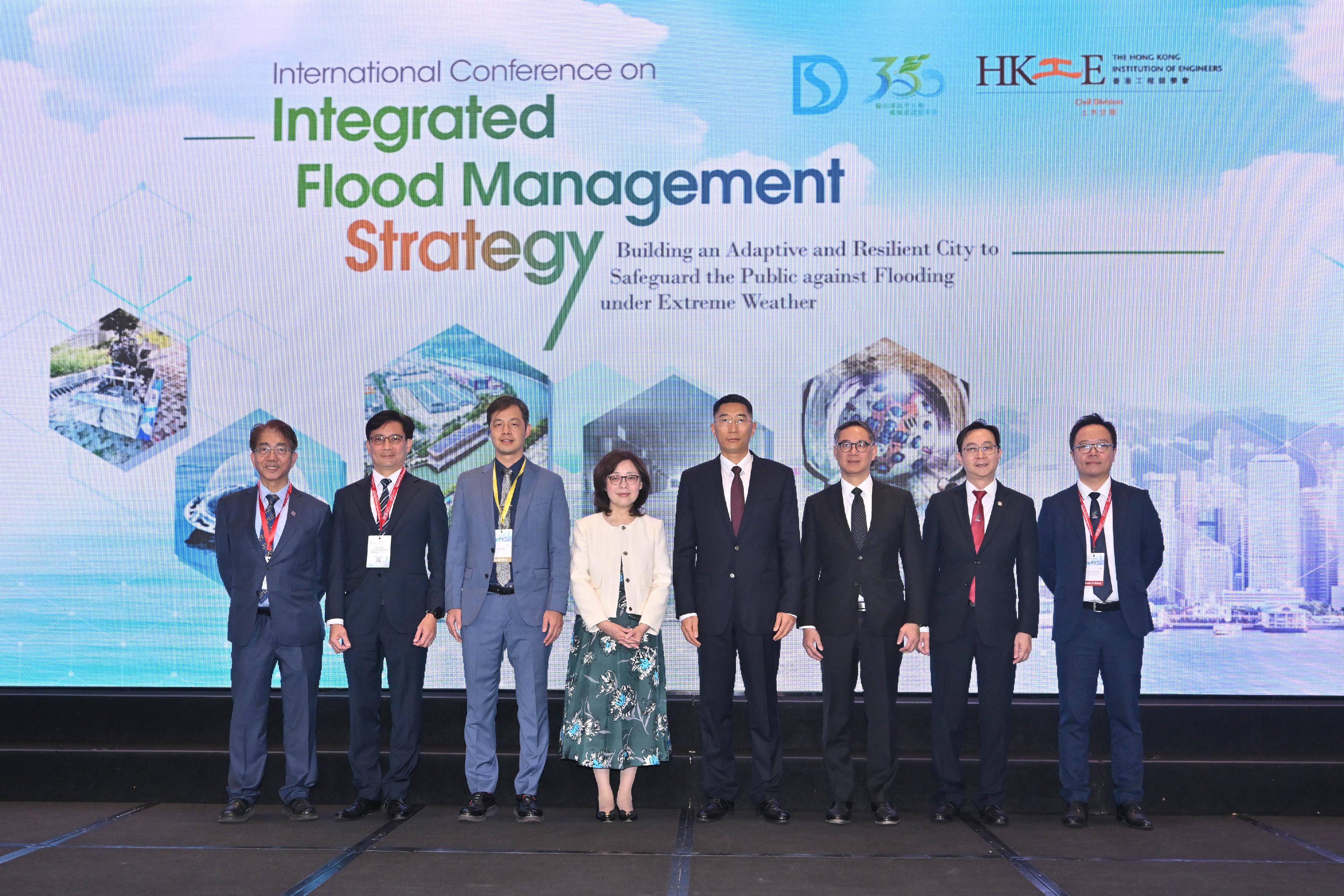 The International Conference on Integrated Flood Management Strategy, organised by the Drainage Services Department and the Civil Division of the Hong Kong Institution of Engineers, was held today (December 3) to foster co-operation and experience sharing in flood control, as well as to promote the development of global comprehensive flood control management strategies. Photo shows (from left) the Vice-Chancellor and President of the Macau University of Science and Technology, Professor Joseph Lee; the Director of Drainage Services, Mr Ringo Mok; Vice-Dean of School of Civil Engineering of Tsinghua University Professor Zhao Jianshi; the Secretary for Development, Ms Bernadette Linn; the Director of Pearl River Water Resources Commission of the Ministry of Water Resources, Mr Wu Xiaolong; the Permanent Secretary for Development (Works), Mr Ricky Lau; the President of the Hong Kong Institution of Engineers, Mr Eric Ma; and the Chairman of the Civil Division of the Hong Kong Institution of Engineers, Mr Alex Li, at the opening ceremony.