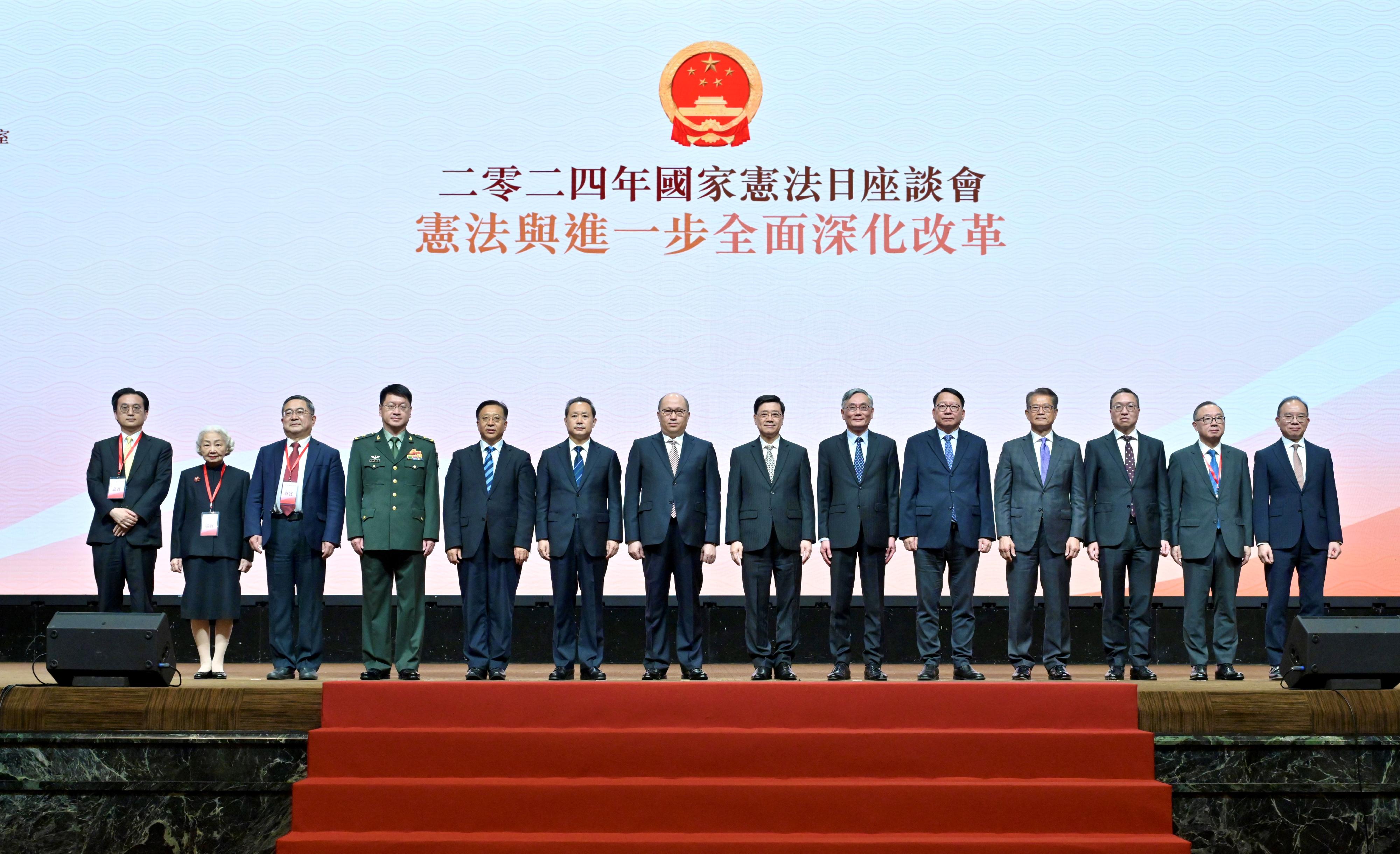 The Chief Executive, Mr John Lee, attended the 2024 Constitution Day Seminar today (December 4). Photo shows Mr Lee (seventh right); the Director of the Liaison Office of the Central People's Government in the Hong Kong Special Administrative Region (HKSAR), Mr Zheng Yanxiong (seventh left); the Head of the Office for Safeguarding National Security of the Central People's Government in the HKSAR, Mr Dong Jingwei (sixth left); the Commissioner of the Ministry of Foreign Affairs in the HKSAR, Mr Cui Jianchun (fifth left); Deputy Political Commissar of the Chinese People's Liberation Army Hong Kong Garrison, Major General Wang Zhaobing (fourth left); Member of the Management Committee of the Endeavour Education Centre Miss Elsie Leung (second left); the Chief Justice of the Court of Final Appeal, Mr Andrew Cheung Kui-nung (sixth right); the Chief Secretary for Administration, Mr Chan Kwok-ki (fifth right); the Financial Secretary, Mr Paul Chan (fourth right); the Secretary for Justice, Mr Paul Lam, SC (third right); and the Secretary for Constitutional and Mainland Affairs, Mr Erick Tsang Kwok-wai (first right), with other guests.