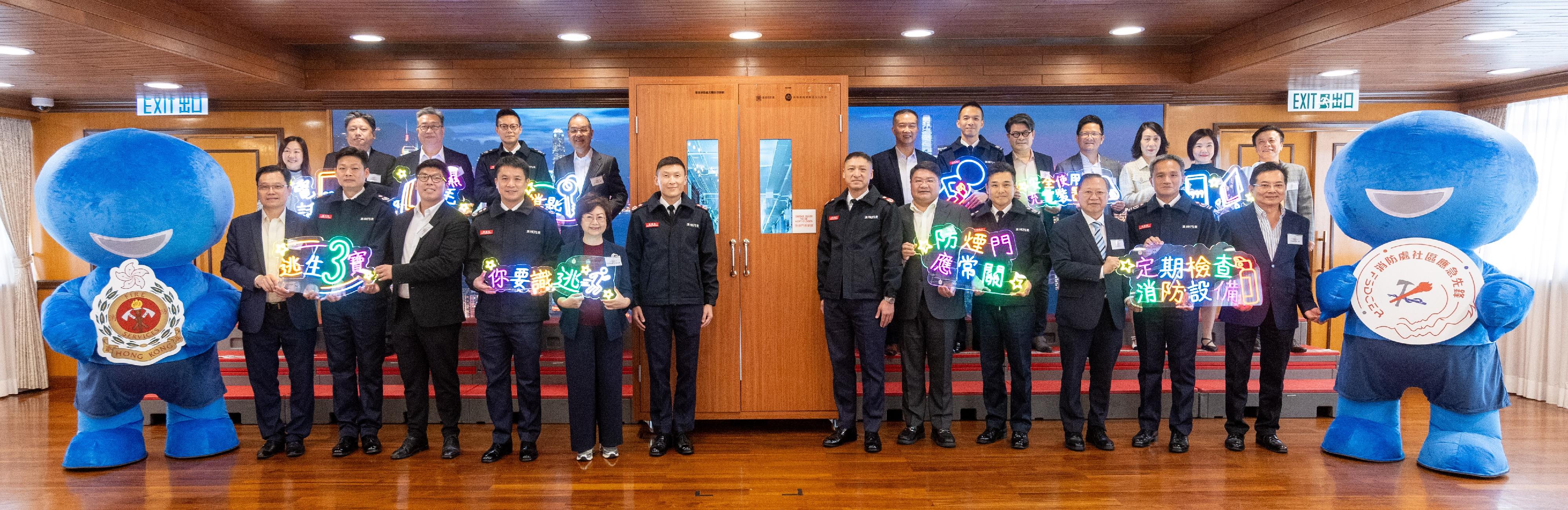 The Fire Services Department (FSD) held a launching ceremony for the Winter Disaster and Emergency Preparedness Promotional Month at Tsim Sha Tsui Fire Station today (December 6). Photo shows the Deputy Director of Fire Services (Public Safety and Corporate Strategy), Mr Derek Armstrong Chan (front row, sixth left), the chairpersons of the 18 District Fire Safety Committees, representatives of the FSD Community Collaboration Network and other guests.
