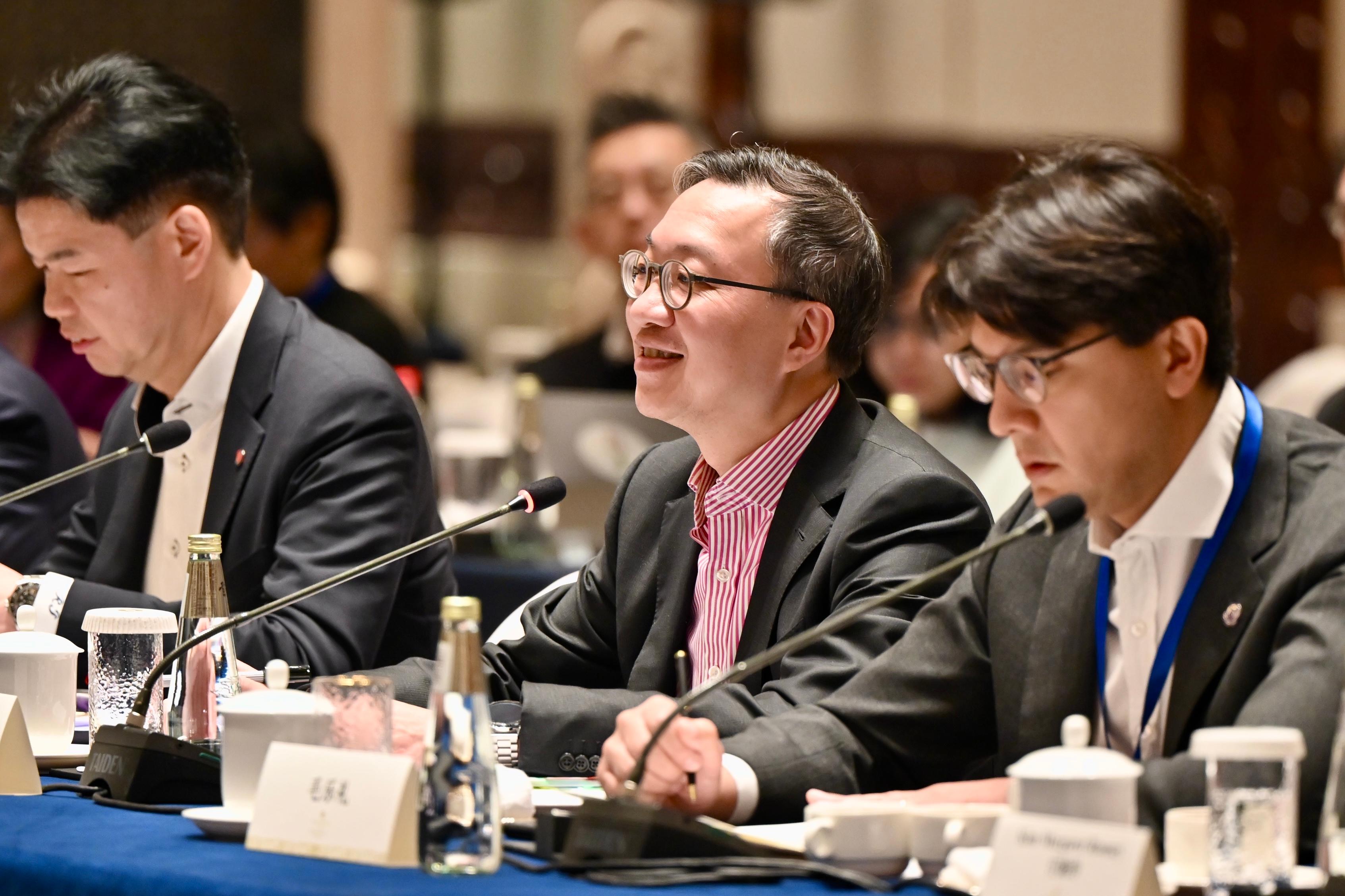 The Secretary for Justice, Mr Paul Lam, SC, leading a Hong Kong delegation of over 30 representatives of foreign-related legal talent from Hong Kong, departed for Shenzhen today (December 6) to continue his visit to Mainland cities of the Guangdong-Hong Kong-Macao Greater Bay Area. Photo shows Mr Lam (centre); the President of the Law Society of Hong Kong, Mr Roden Tong (left); and Vice-Chairman of the Hong Kong Bar Association Mr José-Antonio Maurellet, SC (right) at a meeting with representatives of Shenzhen Municipal People's Government.