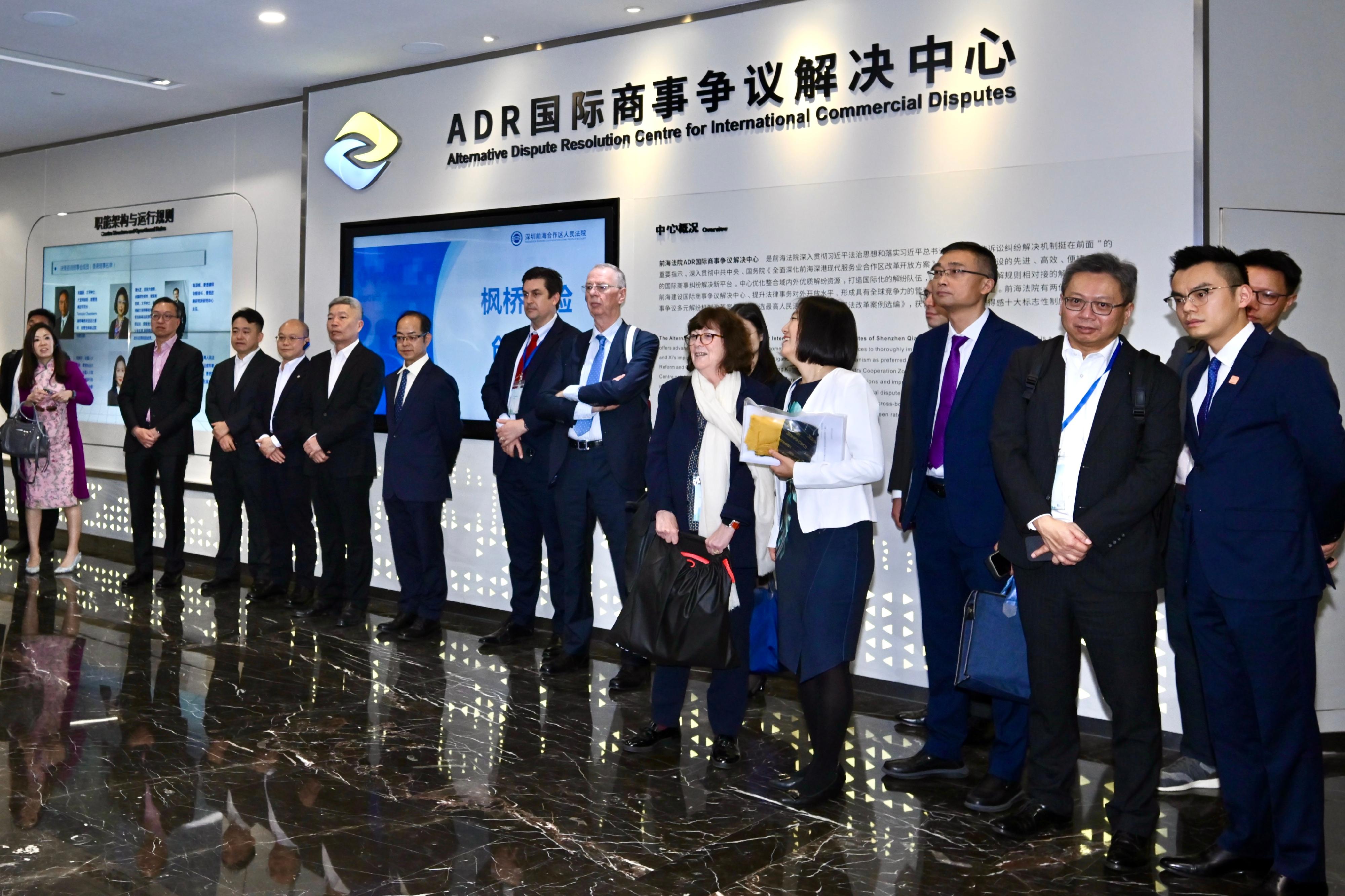 The Secretary for Justice, Mr Paul Lam, SC, leading a Hong Kong delegation of over 30 representatives of foreign-related legal talent from Hong Kong, departed for Shenzhen today (December 6) to continue his visit to Mainland cities of the Guangdong-Hong Kong-Macao Greater Bay Area. Photo shows Mr Lam (second left) and the delegation visiting Shenzhen Qianhai Cooperation Zone People's Court before meeting with representatives from Mainland courts and other organisations.