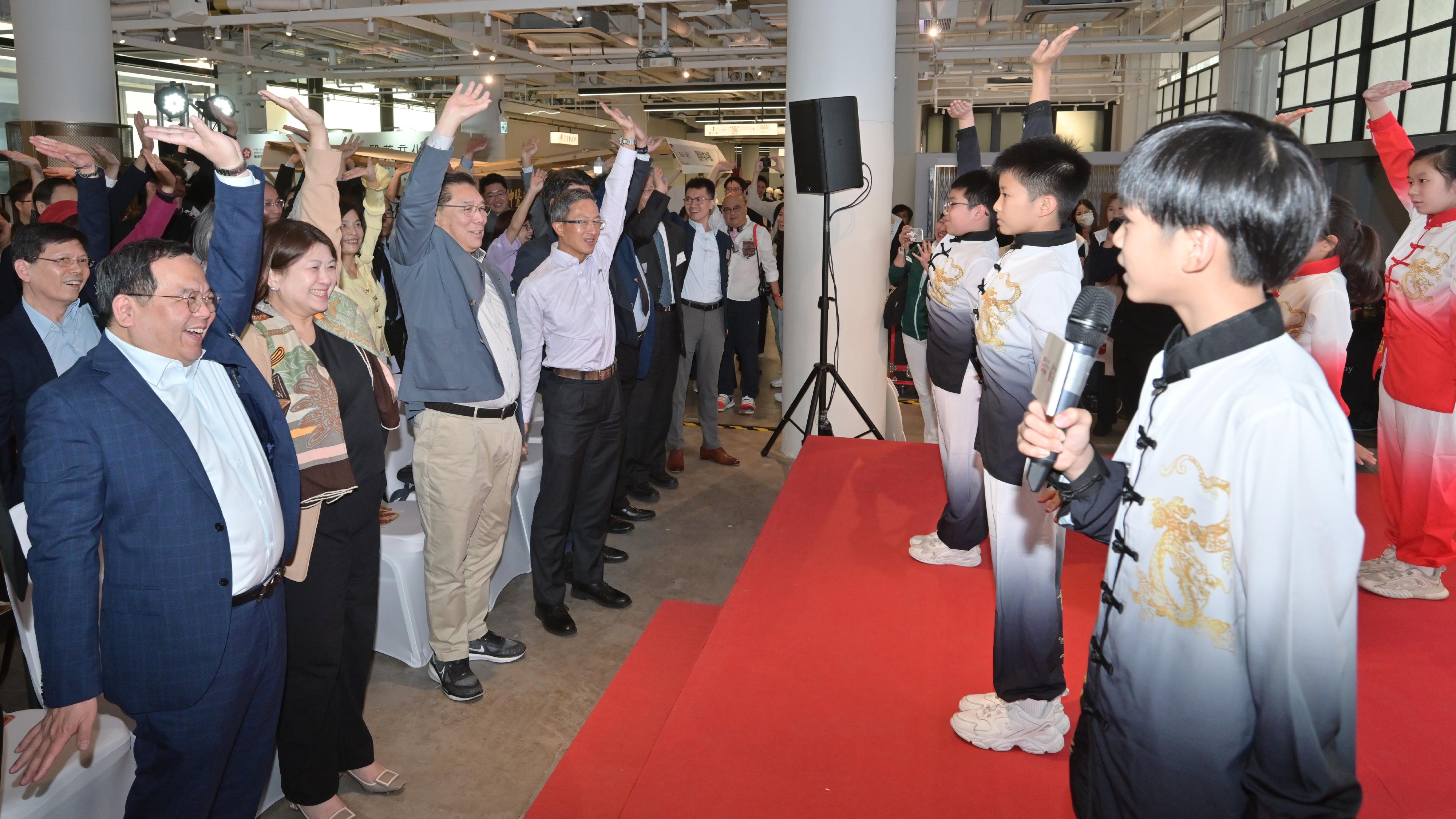 The Health Bureau held the kick-off event for the Hong Kong Chinese Medicine Culture Festival today (December 7). Photo shows primary school students performing at the event a traditional qigong exercise Baduanjin. 
